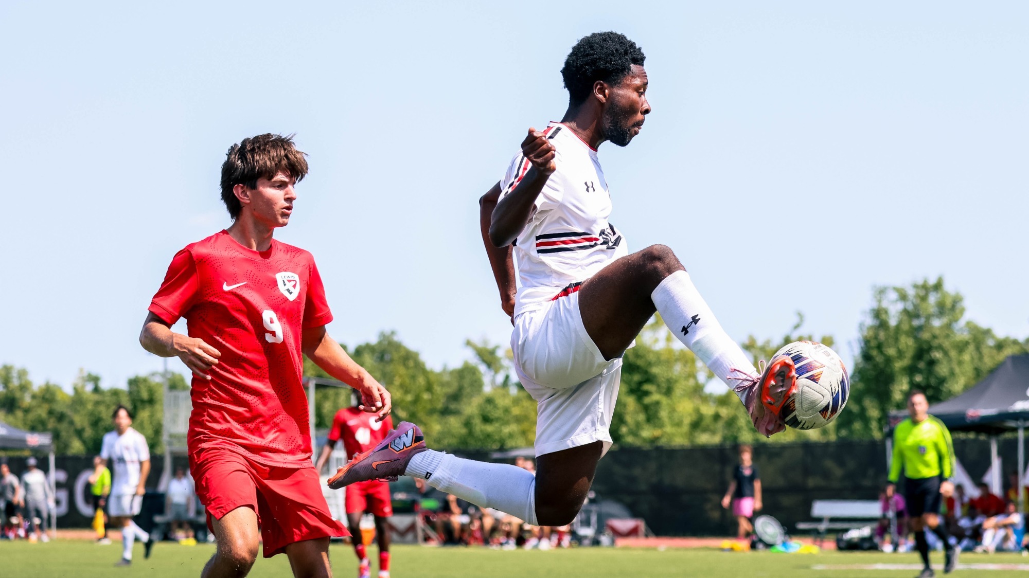 Axton Anom kicks a ball