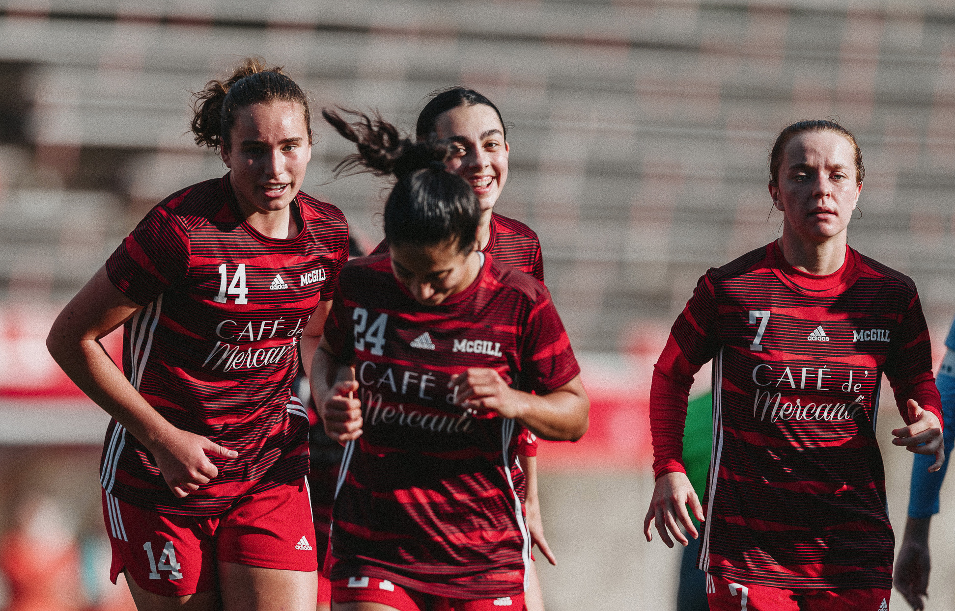 Poppy Honeybone (L) celebrates goal with teammates