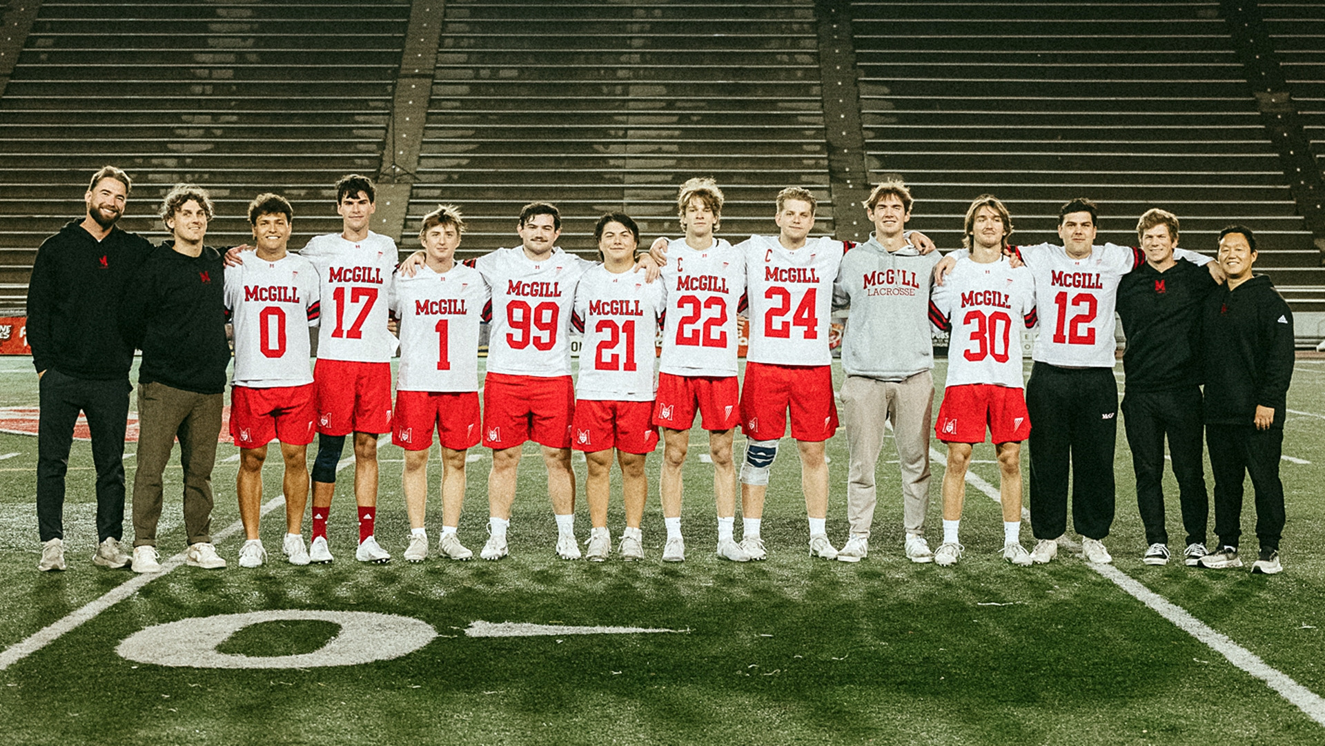 SENIORS SOIREE: McGill coaching staff pose with 10 graduating veterans, including Christopher Koran (0), Joshua Jewell (17), Owen Howard (1), Kyle Glick (99), Mark Symon (21), John Miraglia (22), Adrian Simons (24), Ben Buzby (28), Jack Buzby (30) and Henry Komosa (12)