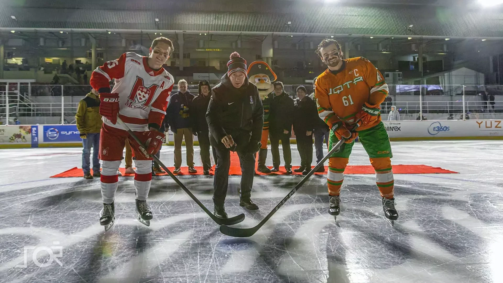 McGill's Mathieu Gagnon performs Winter Classic ceremonial faceoff with UQTR's Conor Frenette
