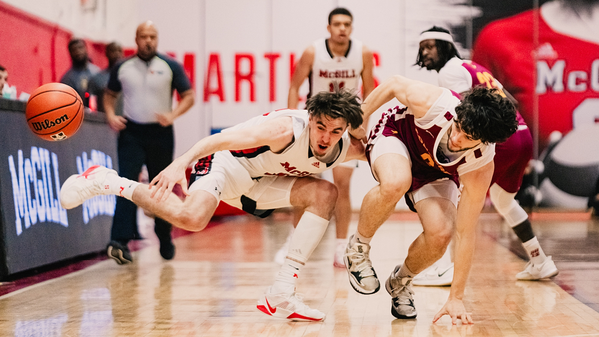 McGill's Alexandre Fortin (#14) fights for loose ball