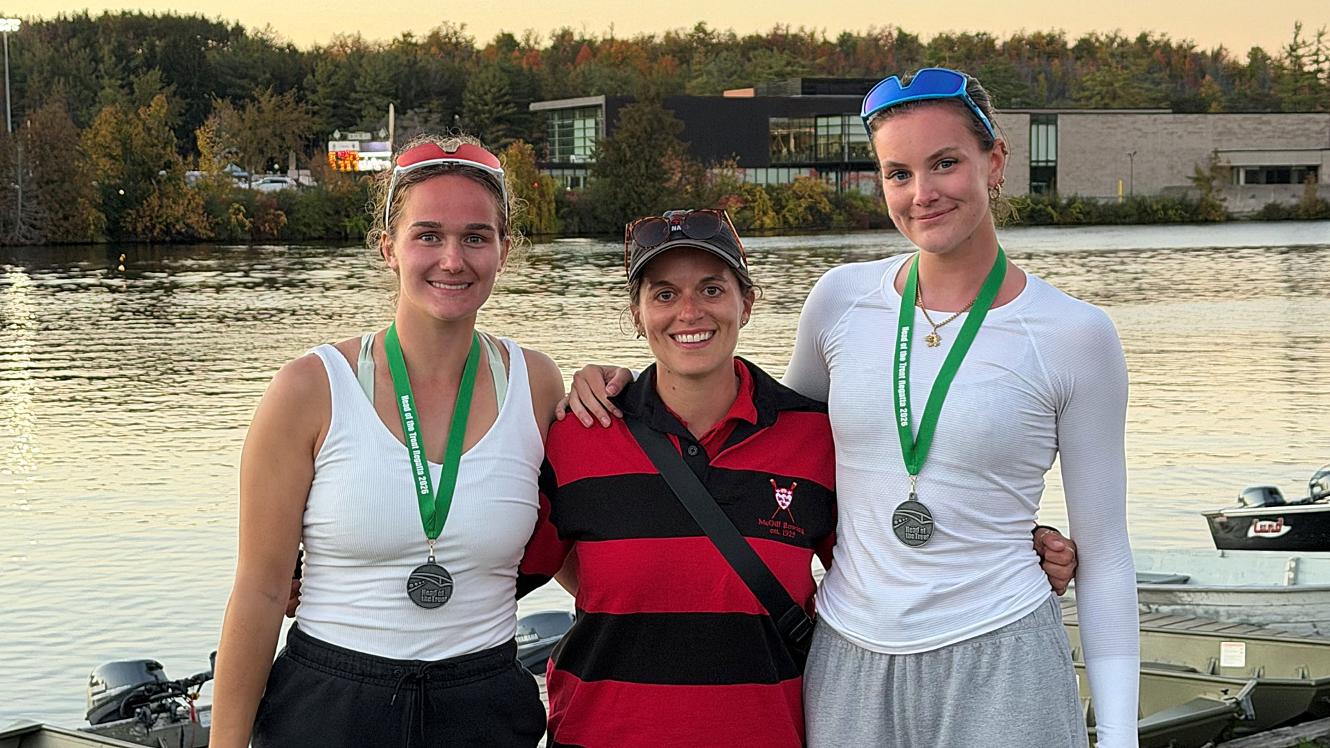 McGill head caoch Stephanie Chartrand (centre) between Sarah Birtulescu and Maria Fletcher, who won gold in the varsity double at the 55th annual Head of the Trent regatta
