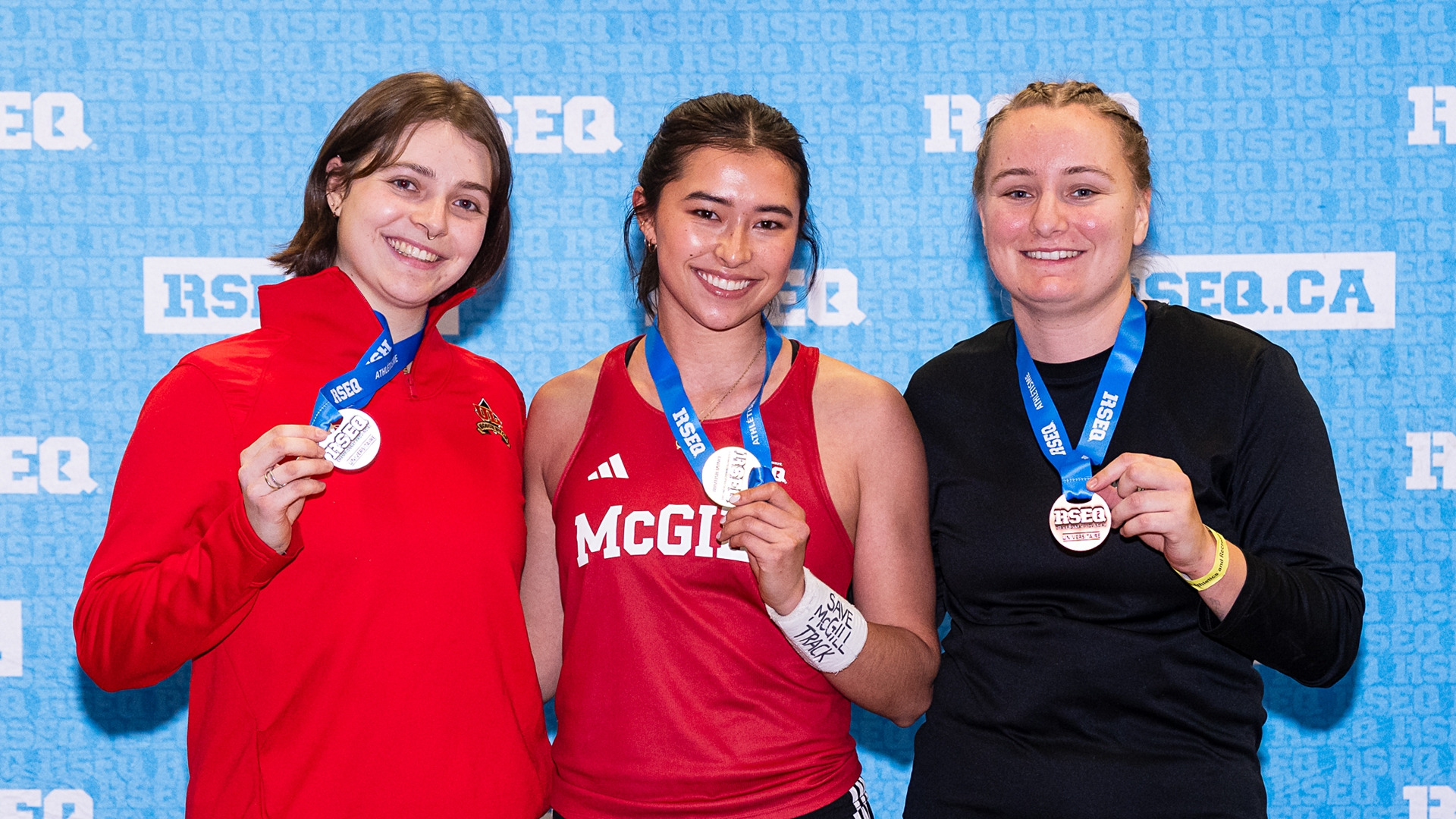  McGill pole vaulter Julie Bortolato (centre) atop the podium at RSEQ championship meet