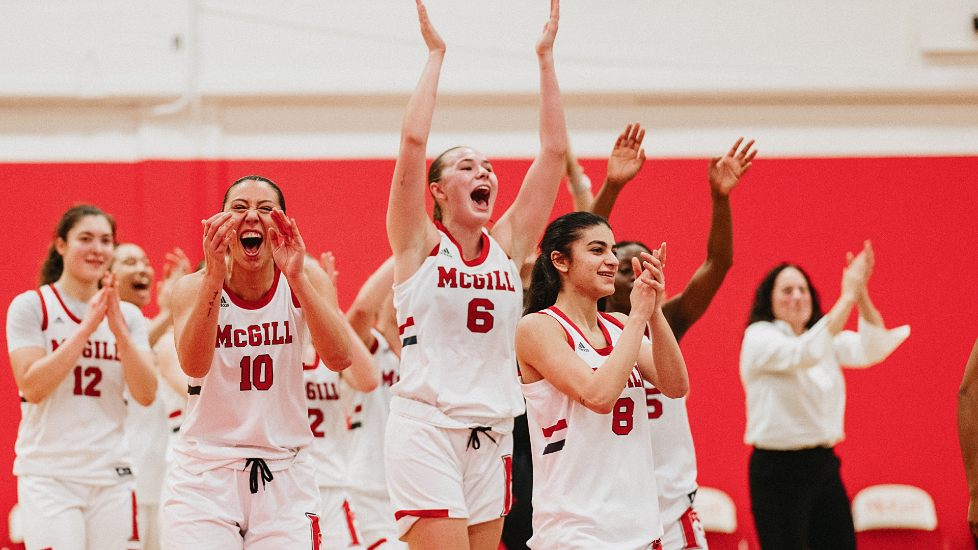 Martlets celebrate semifinal win over Gaiters (L to R): Erica Simeone (12), Kristy Awikeh (10), EJ Scotten (6), Karen Hoteit (8)
