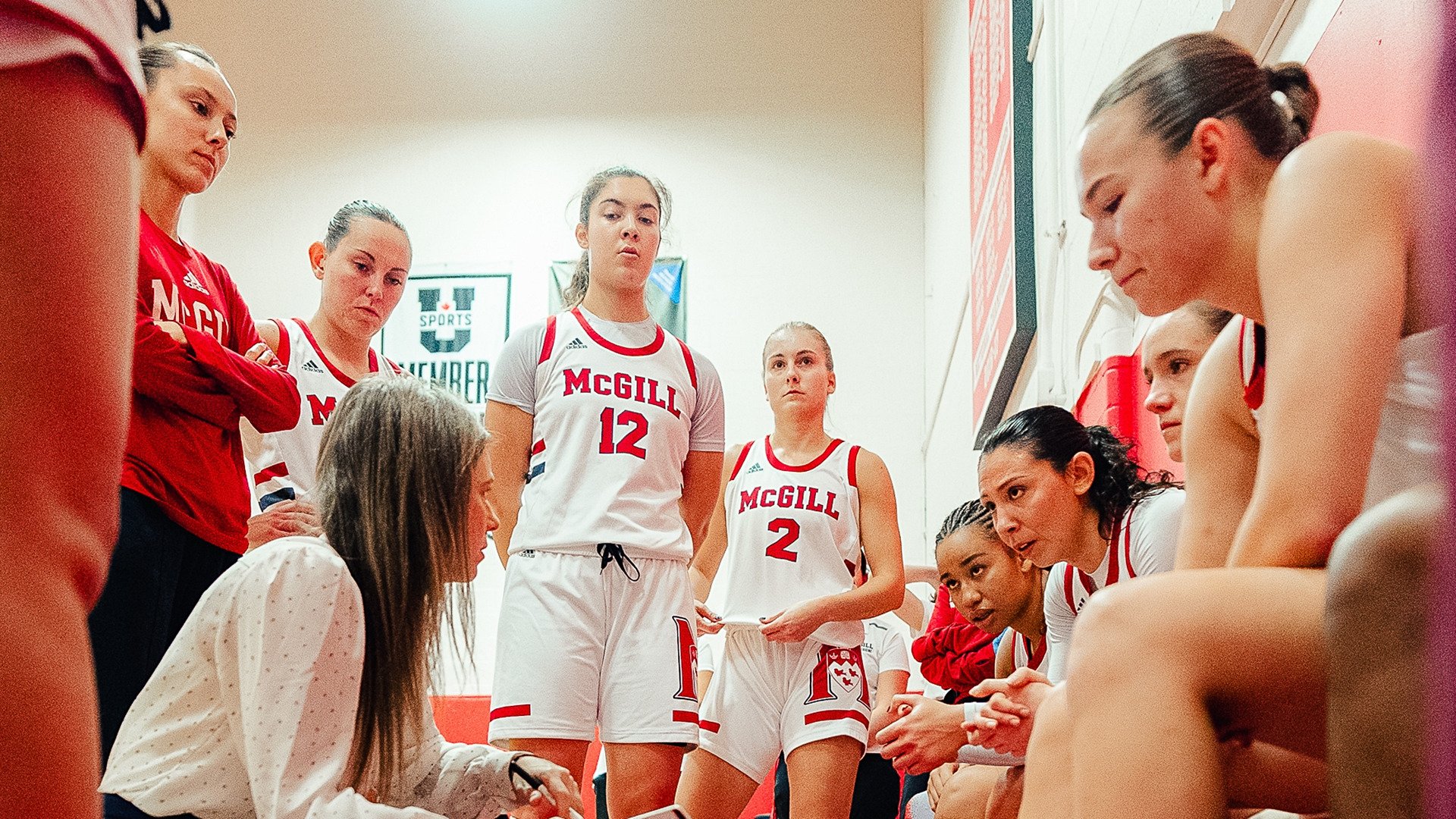Head coach Rikki Bowles addresses the Martlets during a time-out