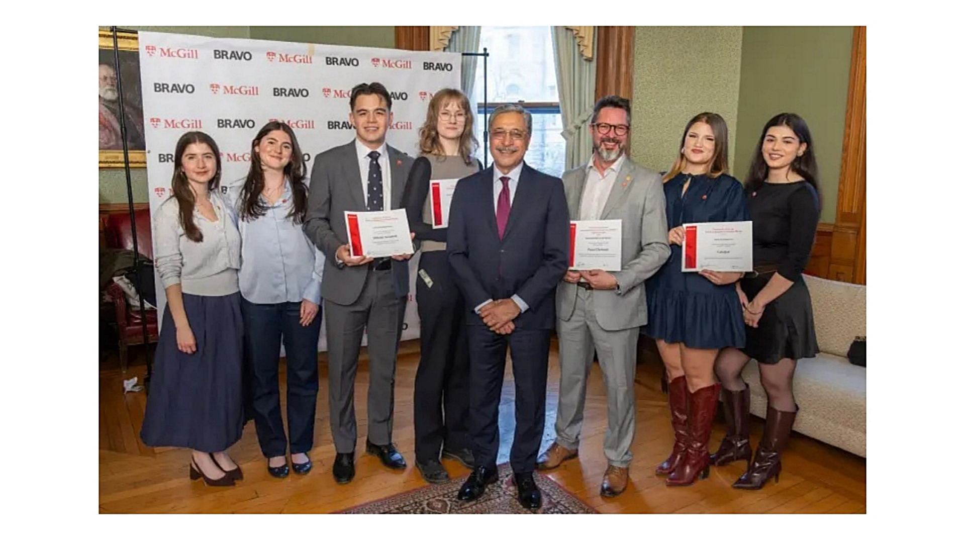 Mikisiw Awashish (third from the left) receives with McGill President Deep Saini