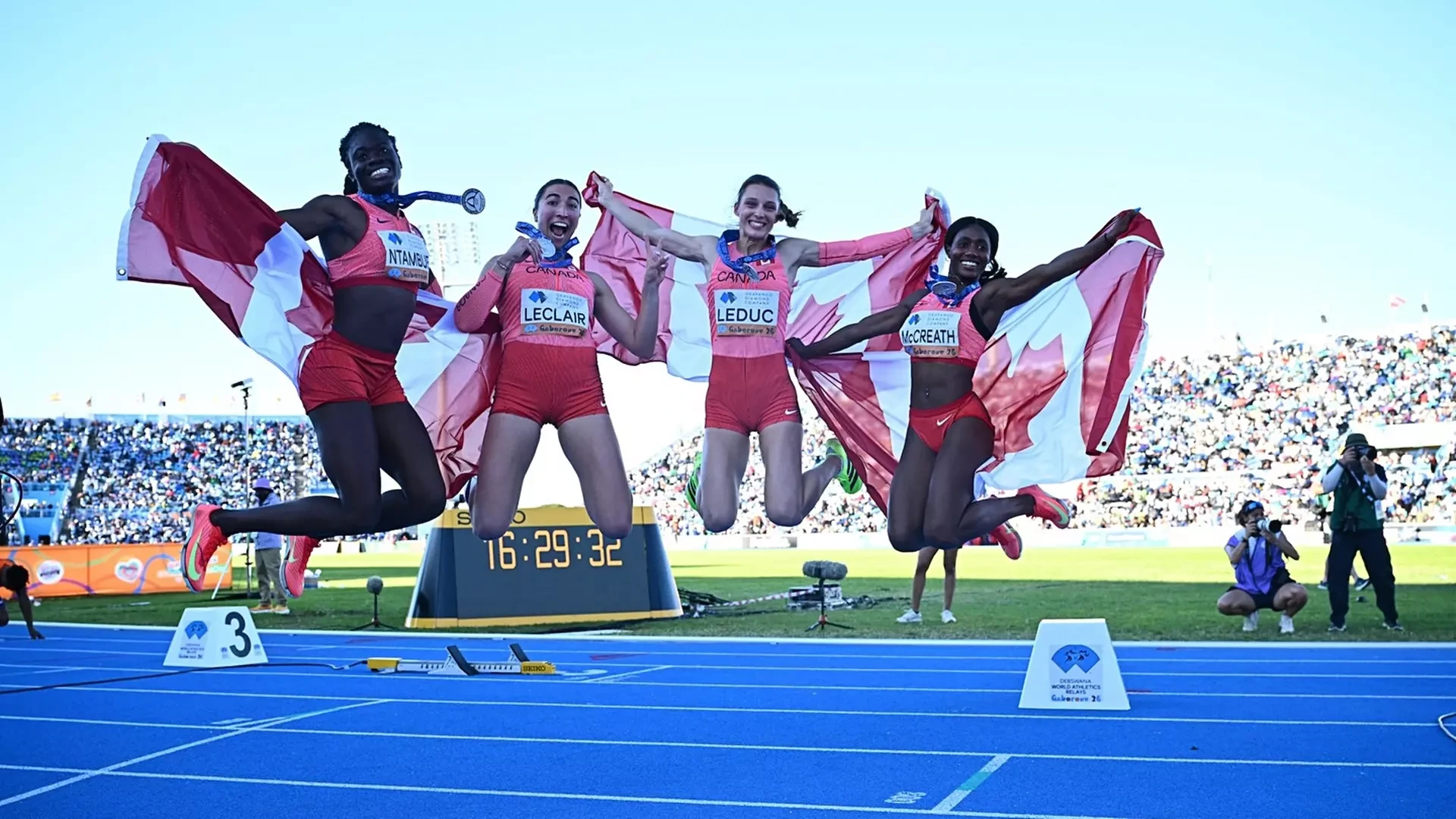 McGill grad Donna Ntambue (L) celebrates silver at 2026 World Relays with Athletics Canada teammates