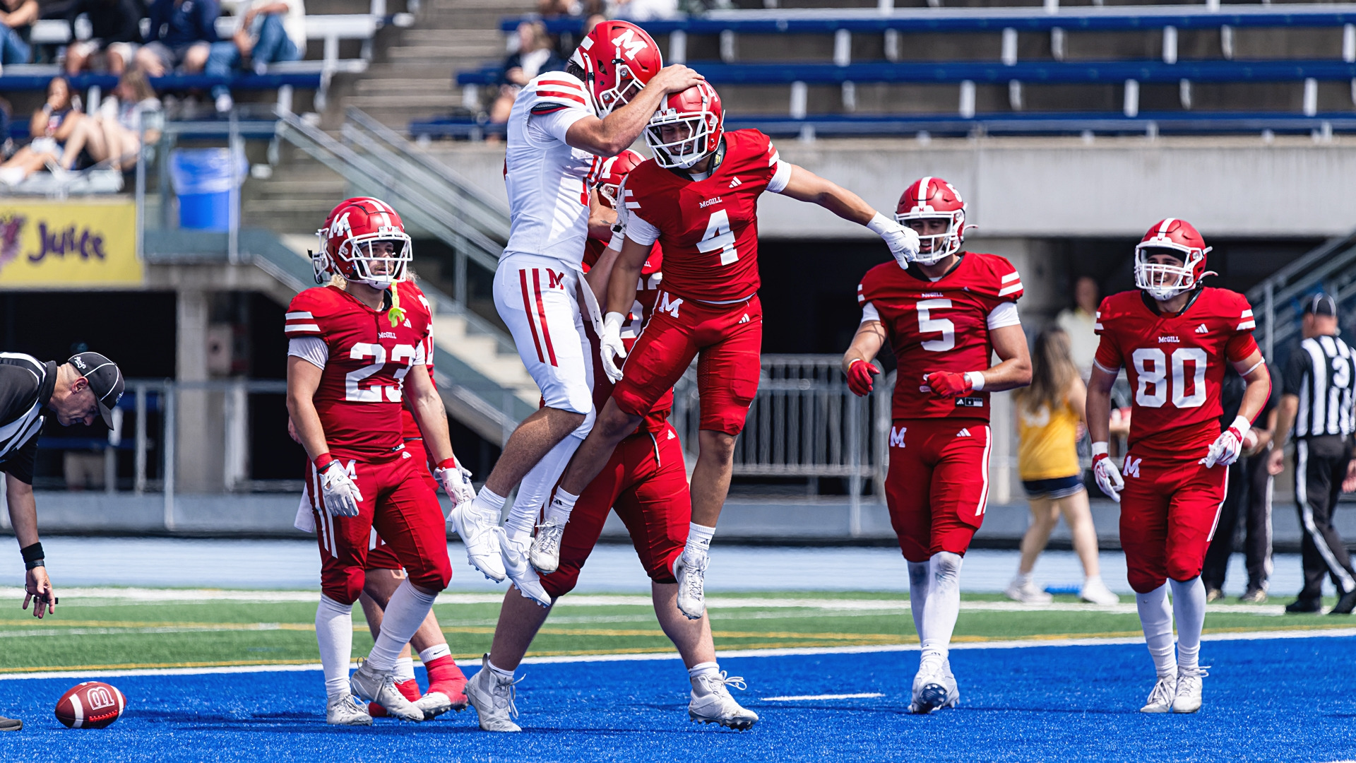 Receiver Samuel Macieira celebrates TD with quarterback Arnaud Dugas