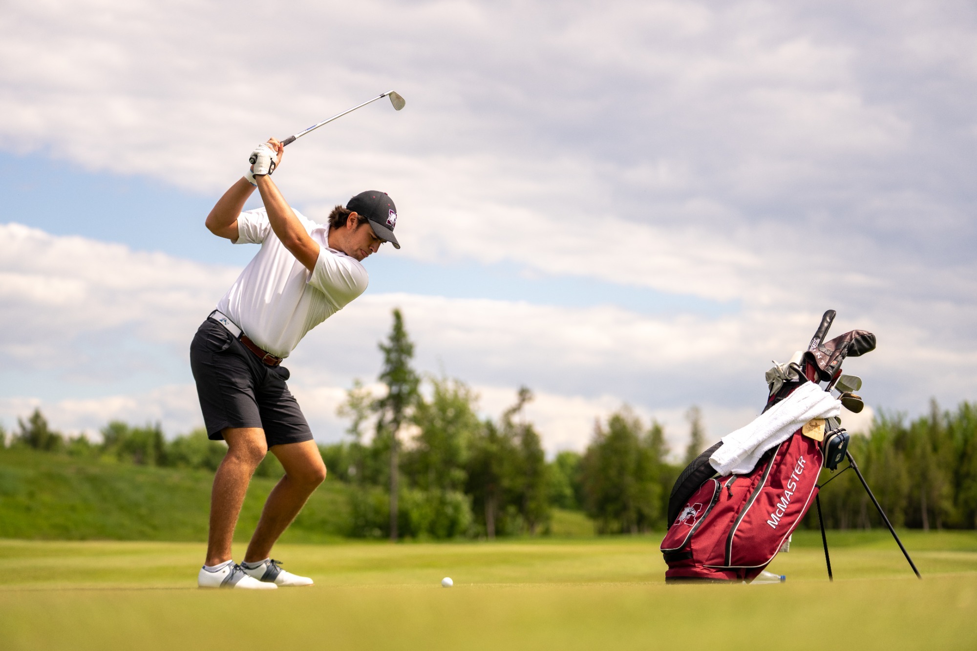 Tyler Hunt takes his approach shot during a practice round at 2026 University/College Championship