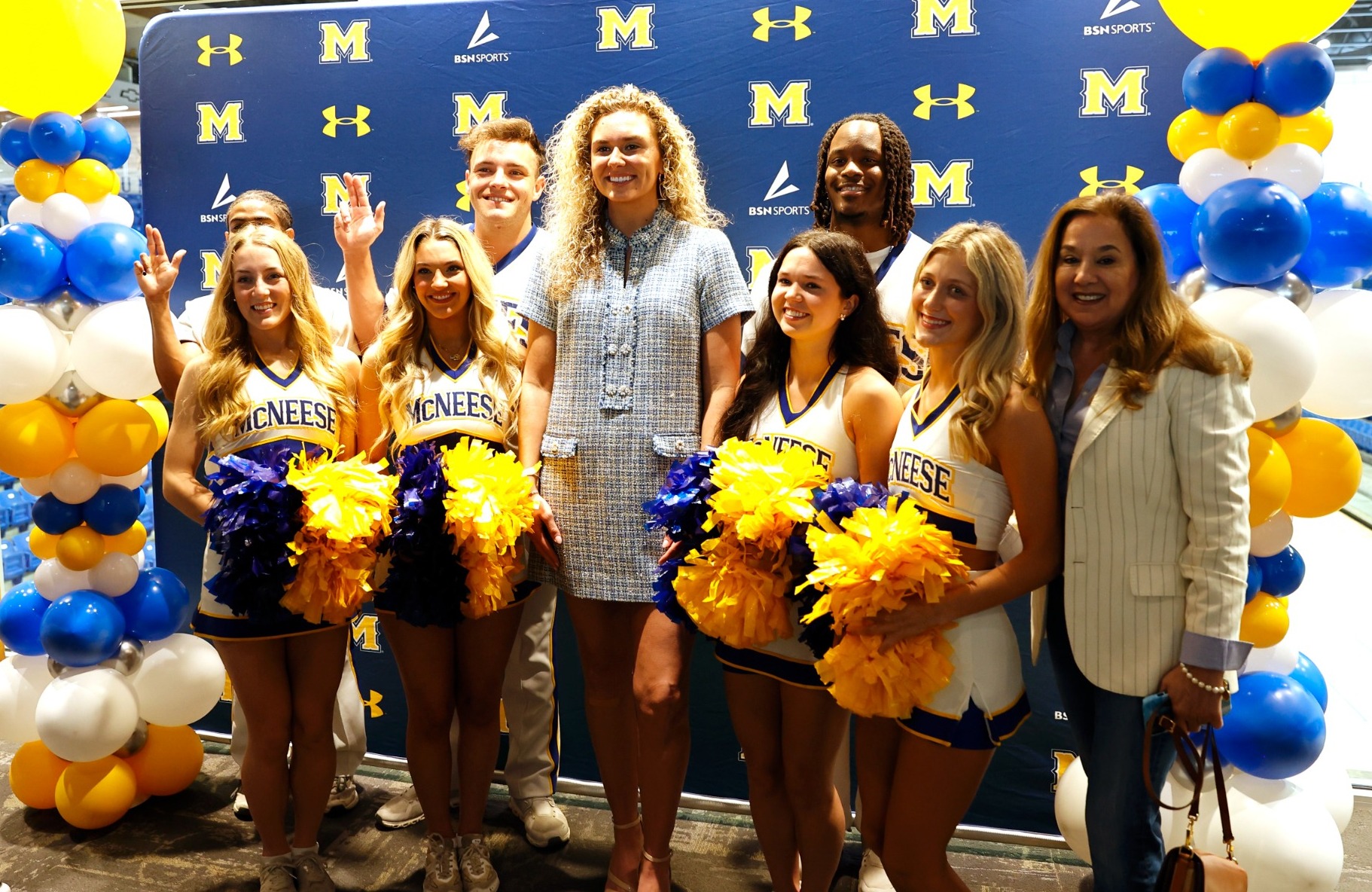 Feldhaus with cheerleaders