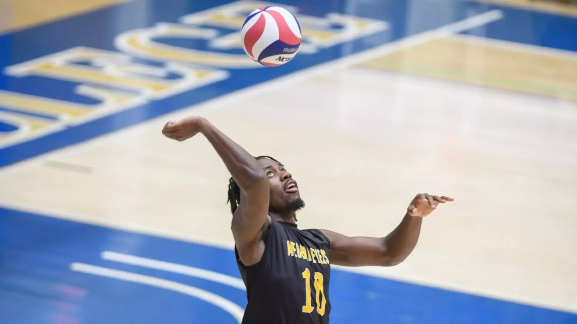 Jahiem Johnson serving the ball