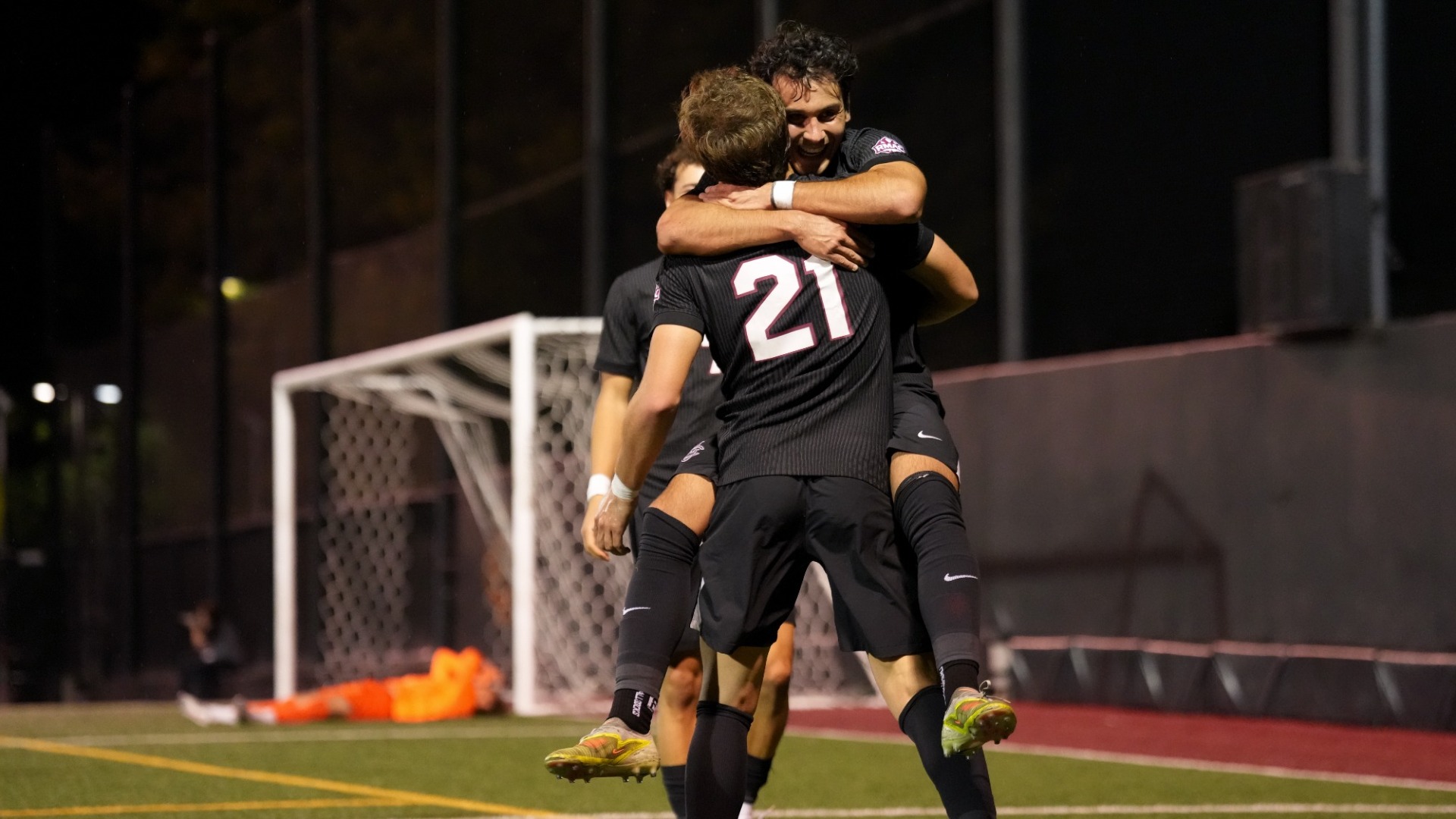 Team Celebrating against UCCS