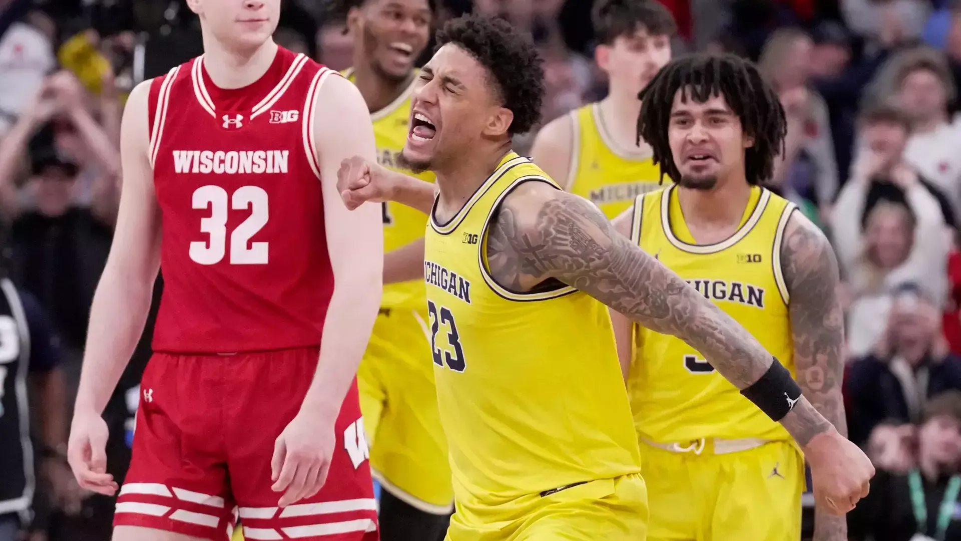 Yaxel Lendeborg of the Michigan Wolverines celebrates after hitting the game-winning three-pointer against Wisconsin in the Big Ten Tournament semifinal at United Center in Chicago March 14 2026