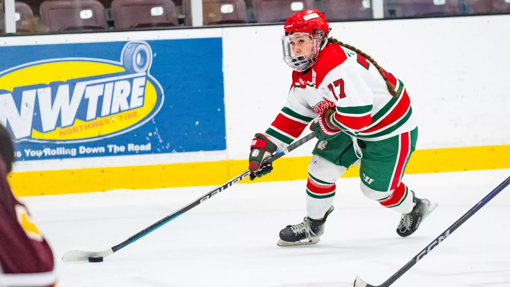 Journey Miller skates with the puck vs Minnesota 