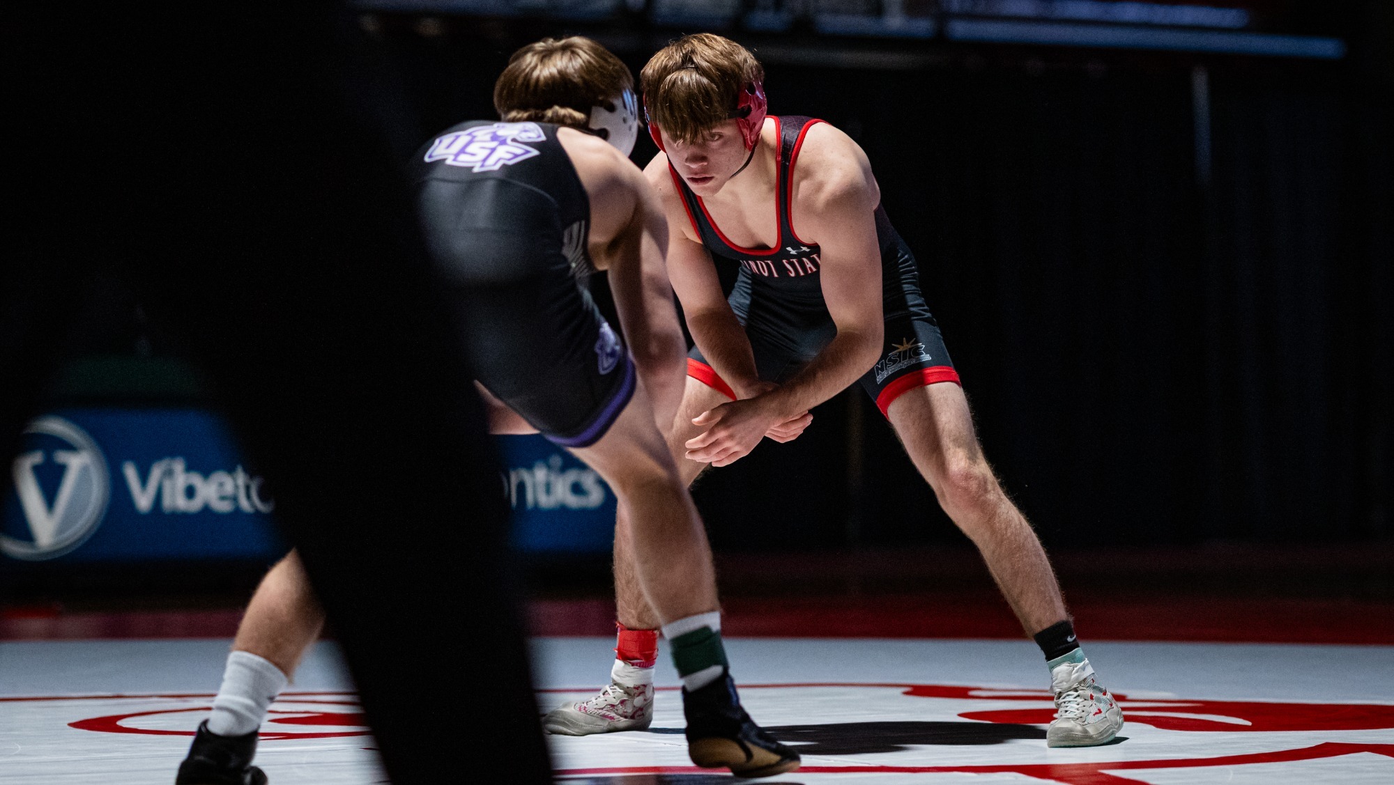 Cole Faircloth wrestles in a match against a Sioux Falls wrestler