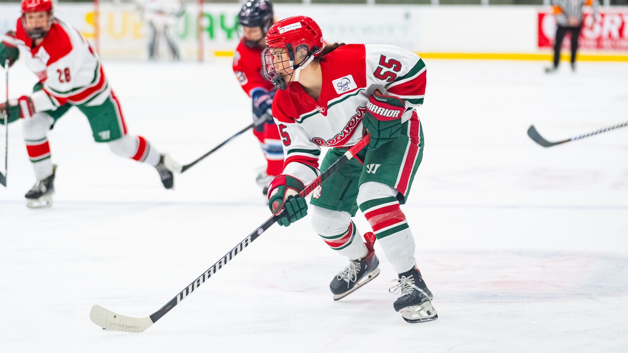 Marlie Rutherford skates the puck up-ice against Minnesota