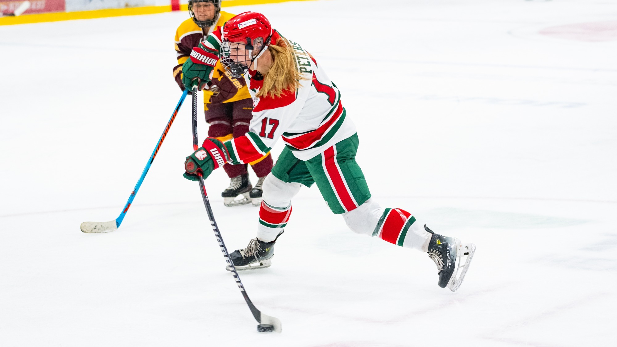 Makayla Peters shoots the puck against Minnesota