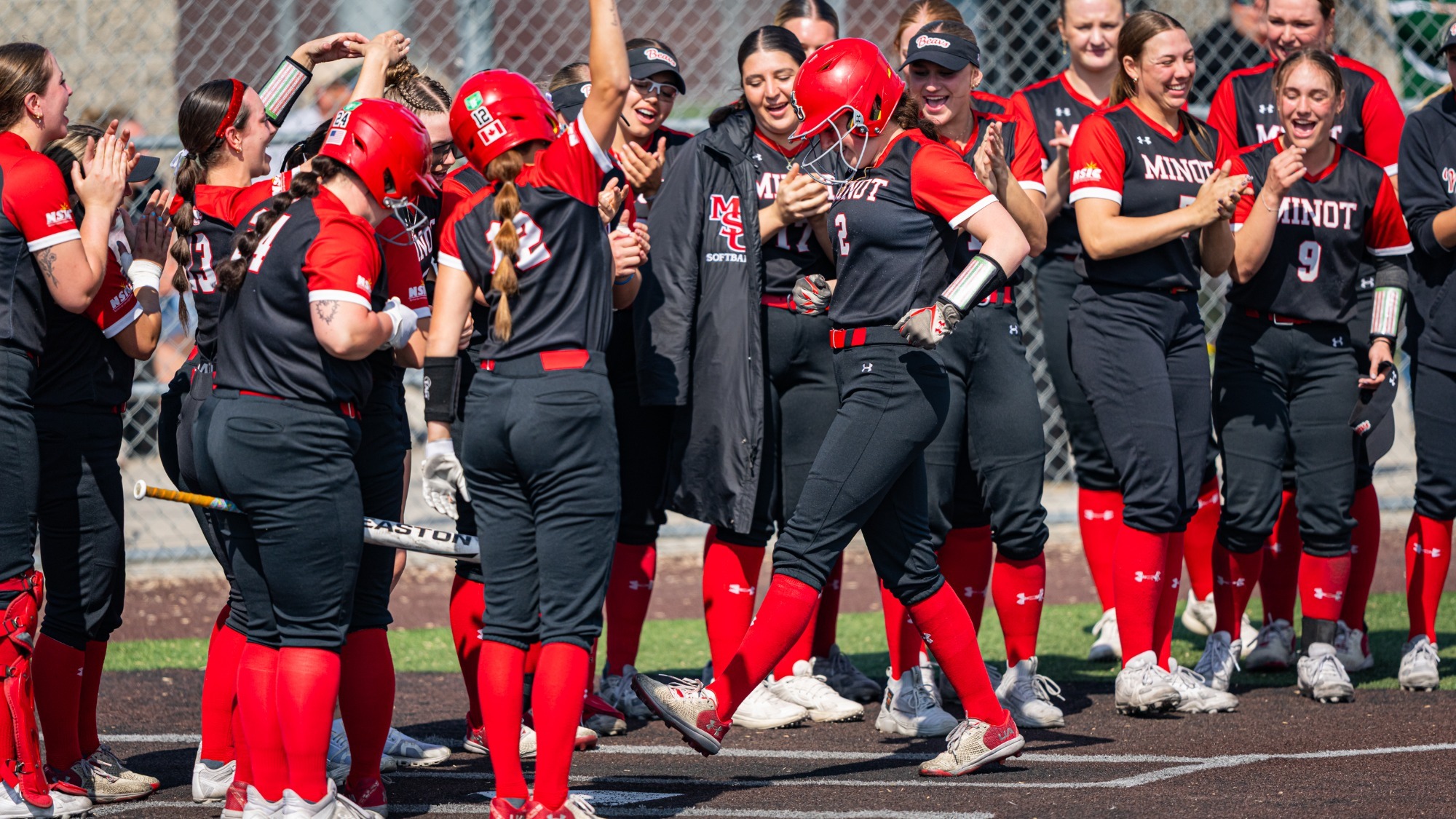 Sara Van Wickler after home run against Minnesota Crookston