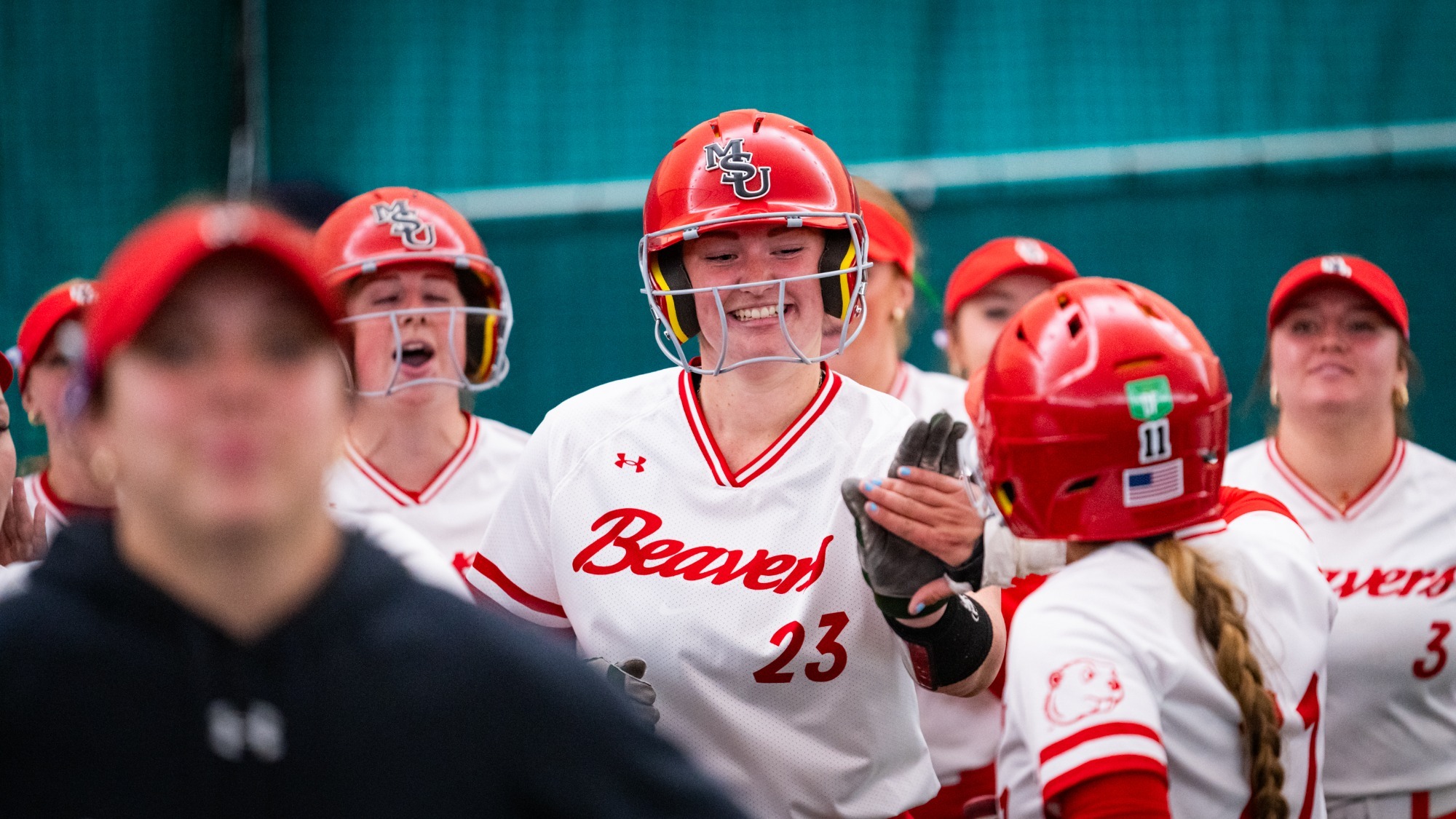 Minot State softball's Maizy Whitlow celebrates a home run