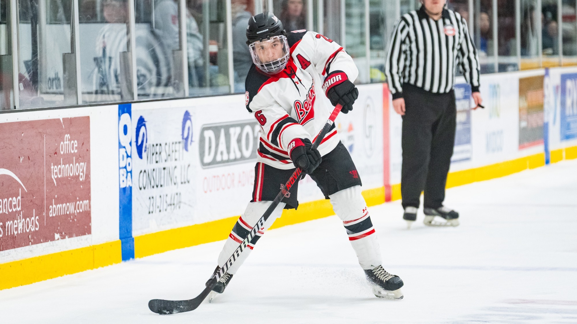 Christian Kadolph with the puck against Calvin
