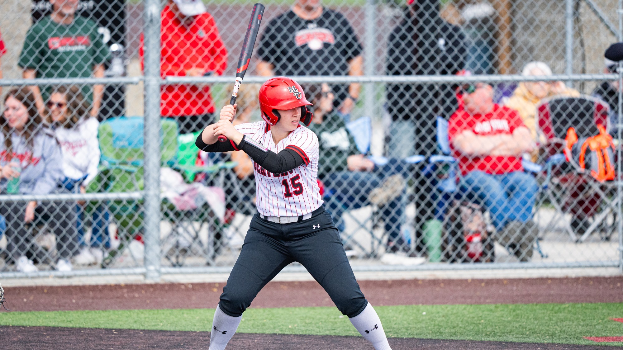 Paige Kellogg batting on senior day