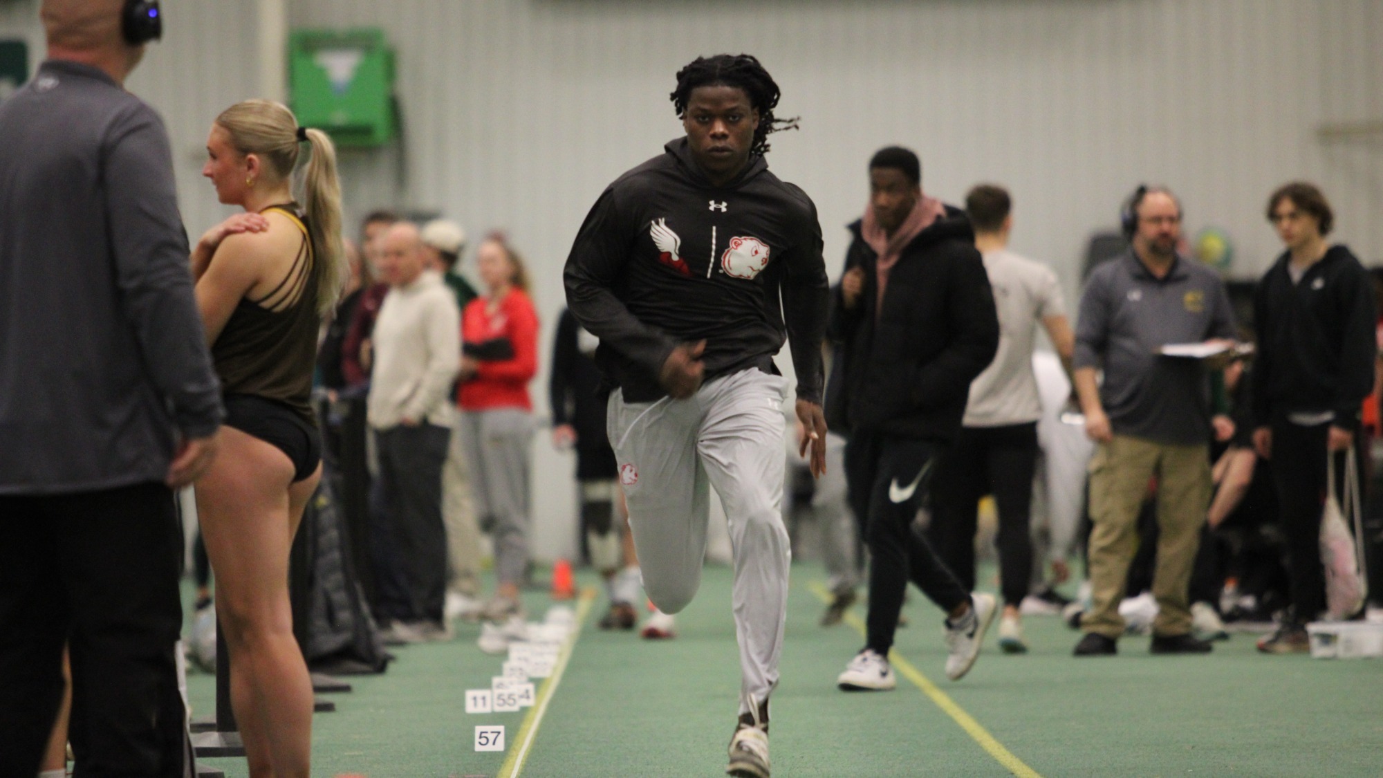Brayan Augustin warms up for long jump