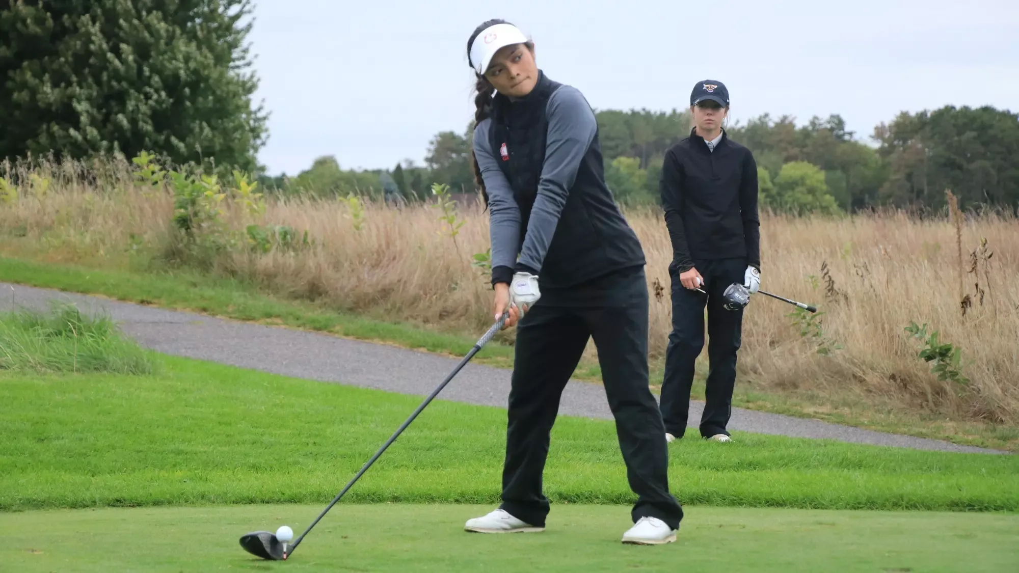 Emily Watts golfs at MSU/CSP Fall Brawl