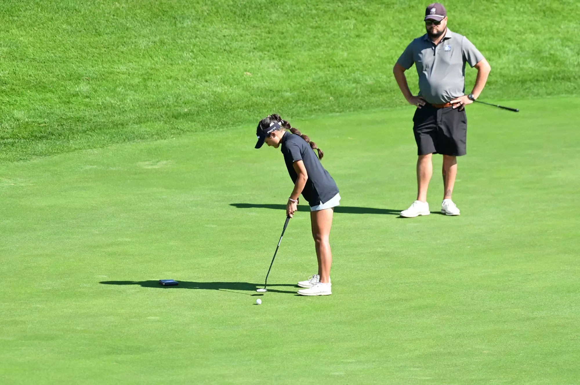 Emily Watts putts at Marauders Invitational