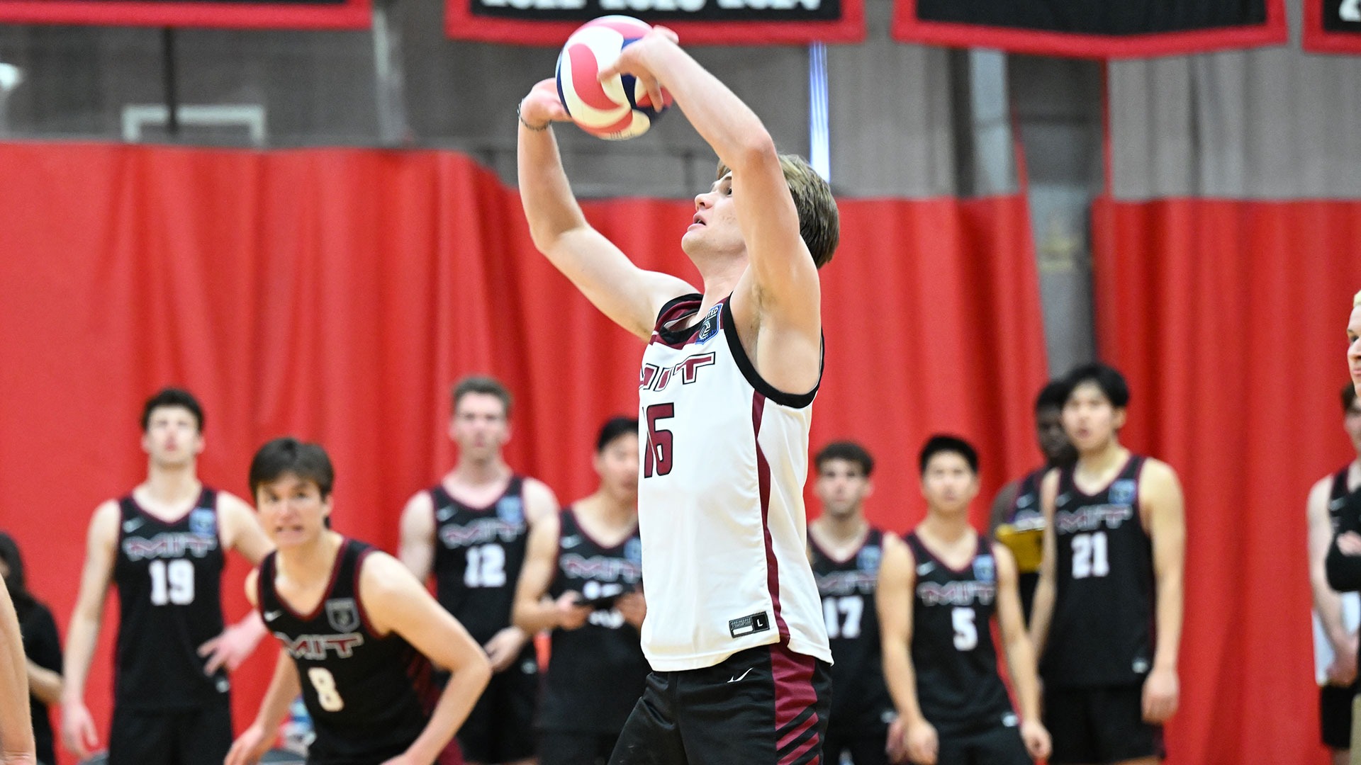 Kevin Windisch setting a volleyball