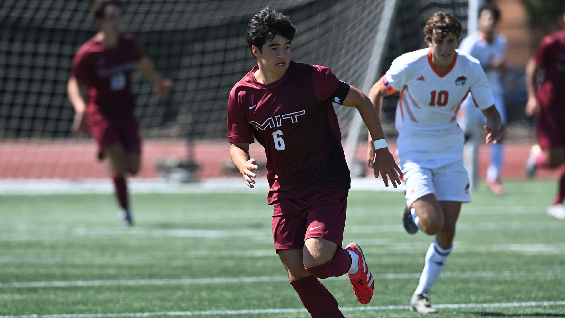 Ethan Reich running down a soccer field