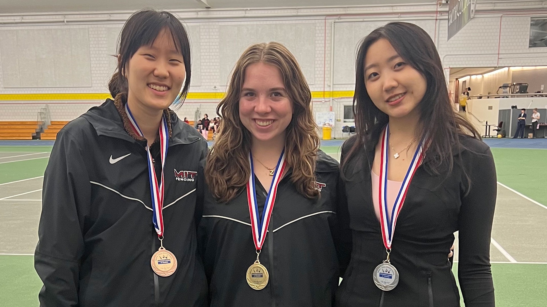 Eugenie Cha, Zandra Feland, and Eunice Choi wearing their medals from The Big One Invitational