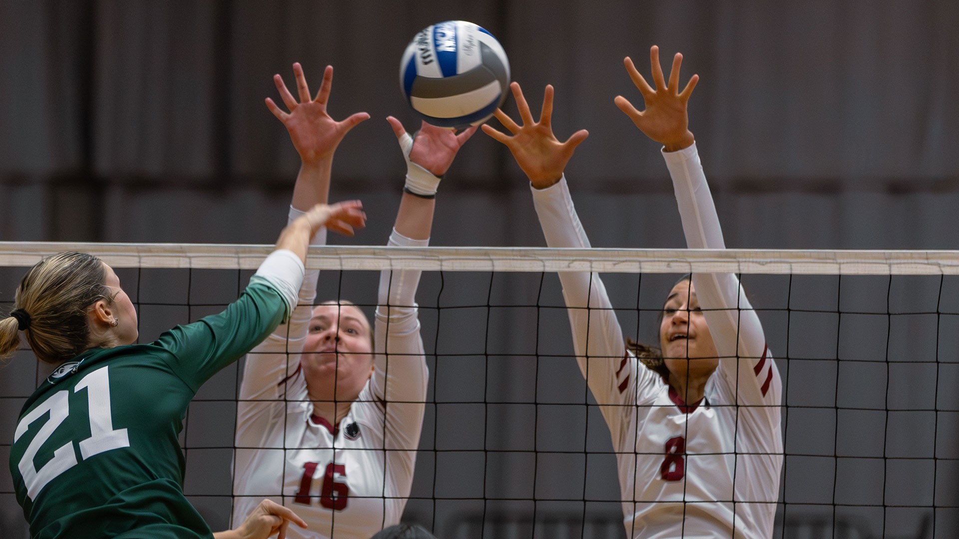 Kayleigh May and Ali Gibbs going up for a block