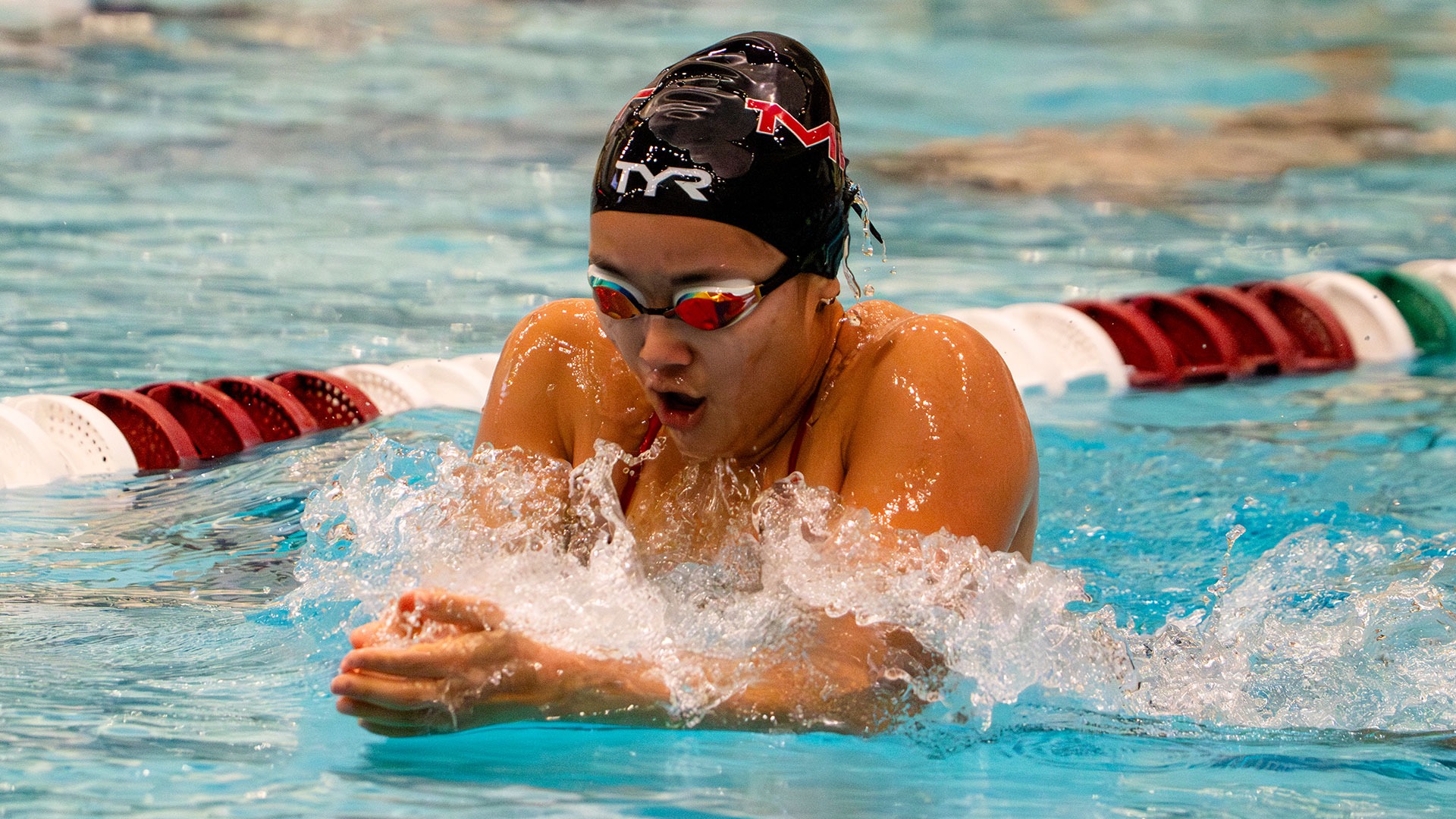 A MIT women's swimmer competing in a competition