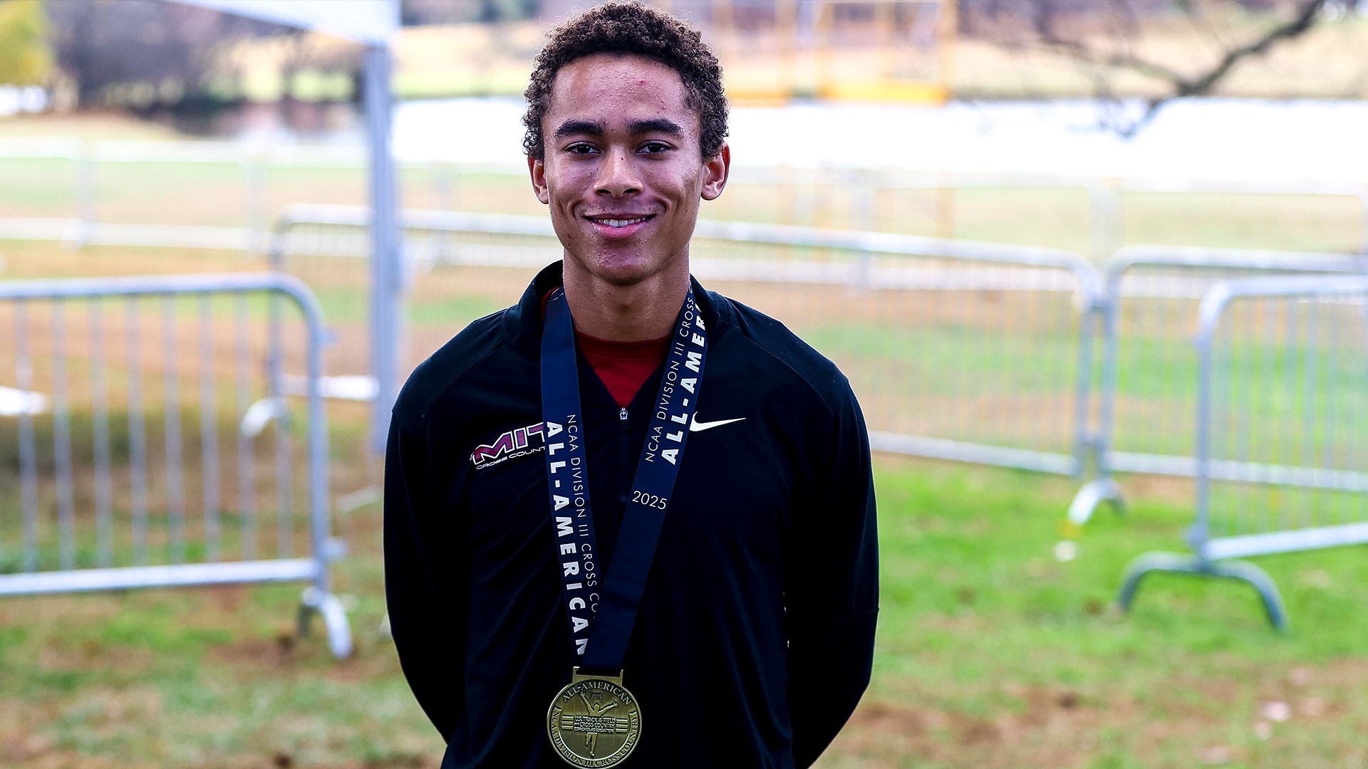 Renne Cooper wearing an All-America medal