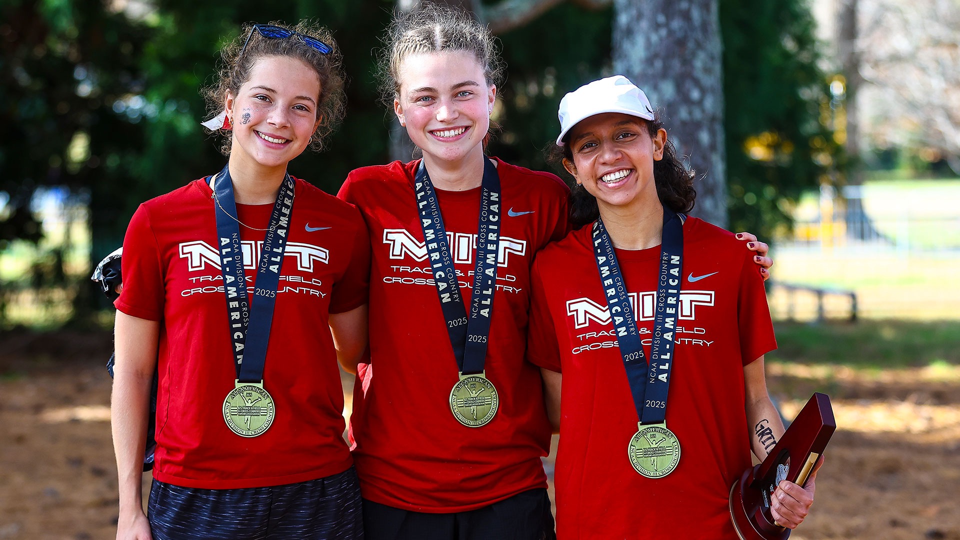 Kate Sanderson, Rijuta Sane and Live Girand with All-America medals