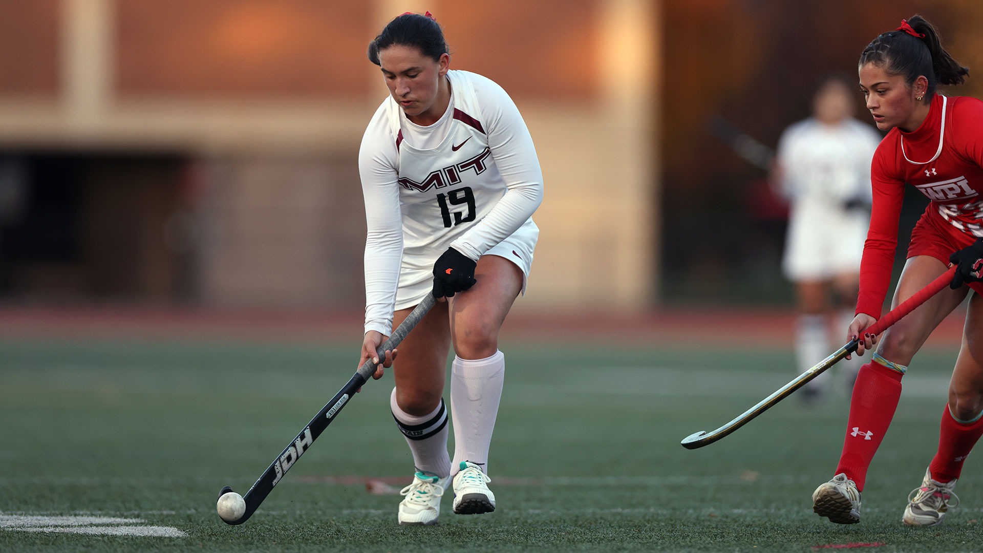 Marisa Montione dribbling the ball down the field