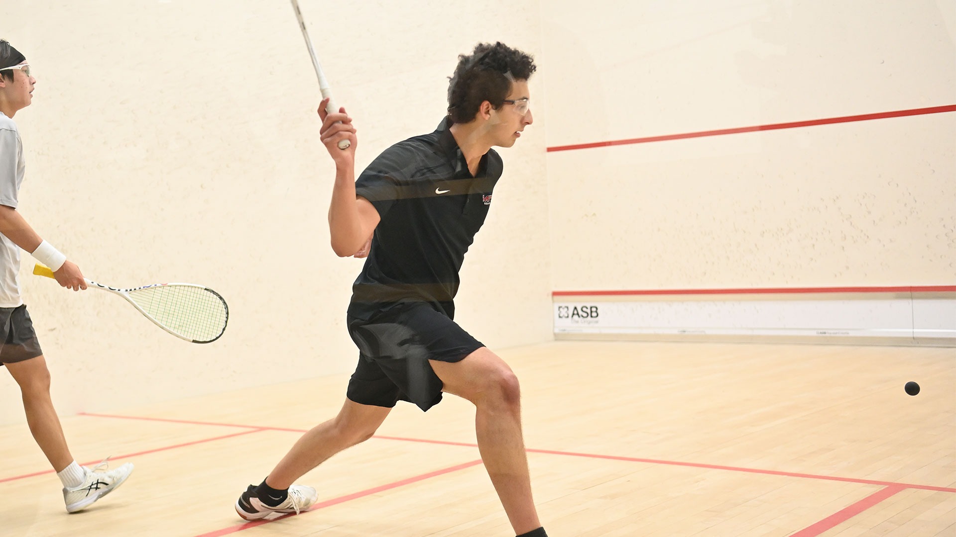 Mero Elmarassy hitting a squash ball