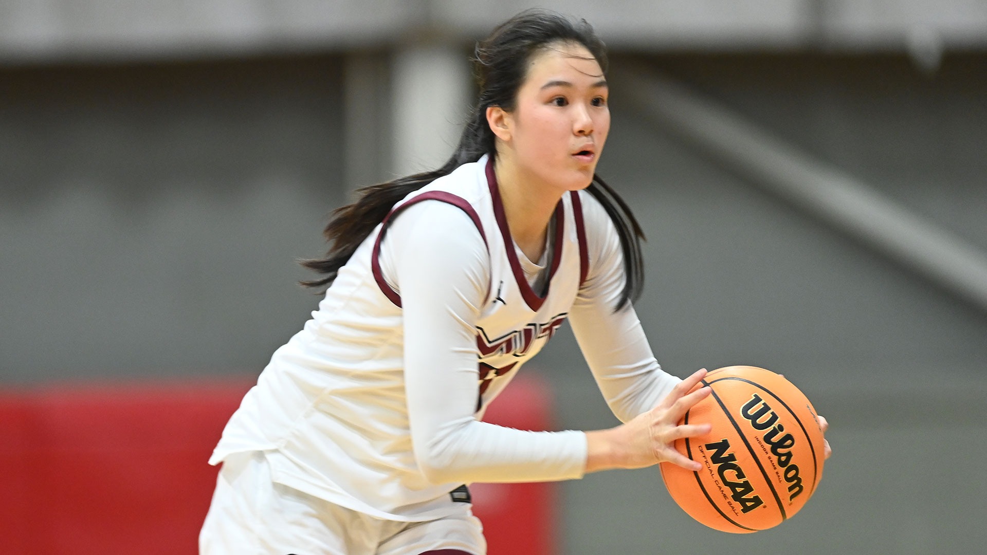 April Chan looking to pass the basketball