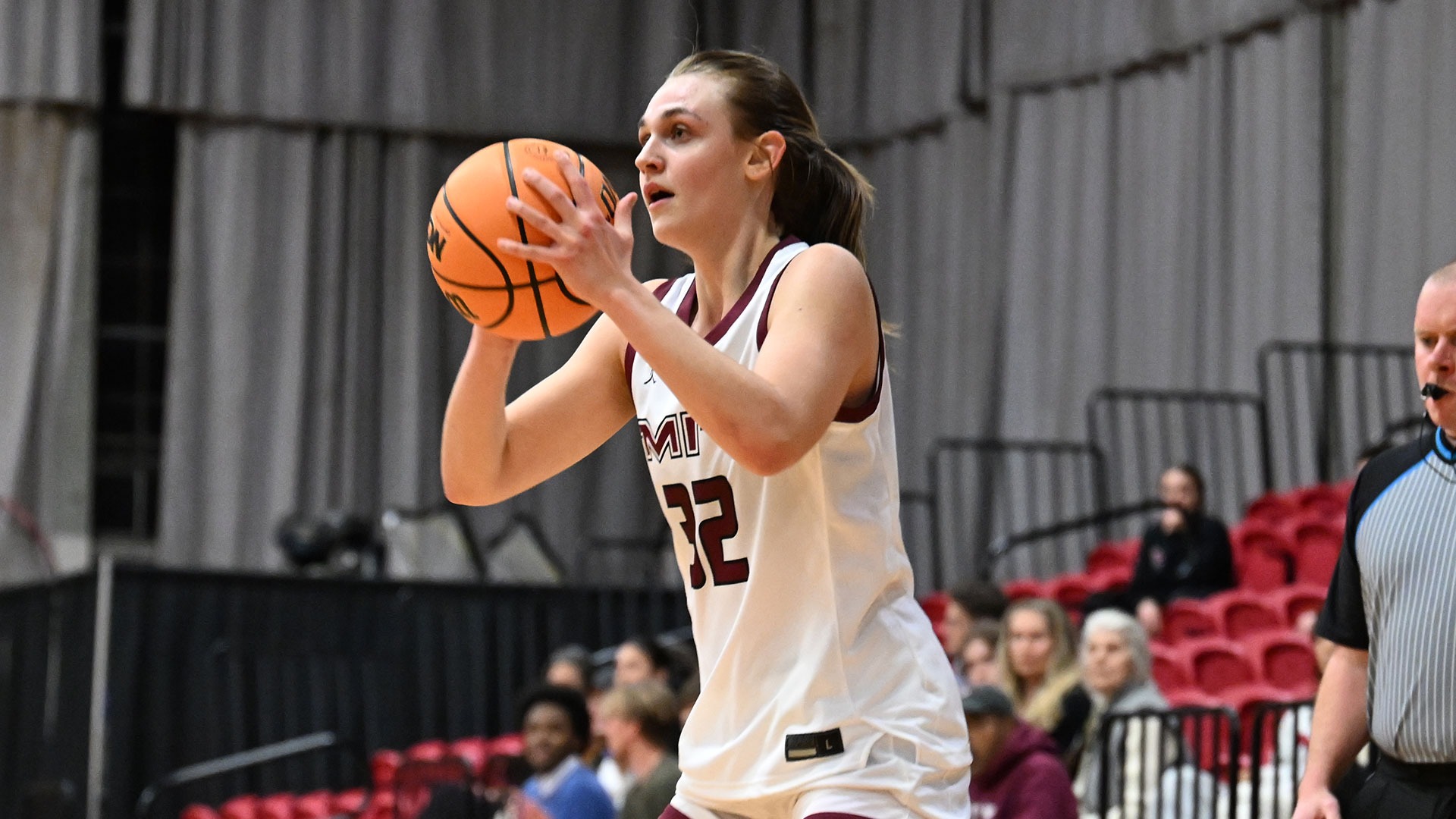 Olivia Joseph looking to pass the basketball