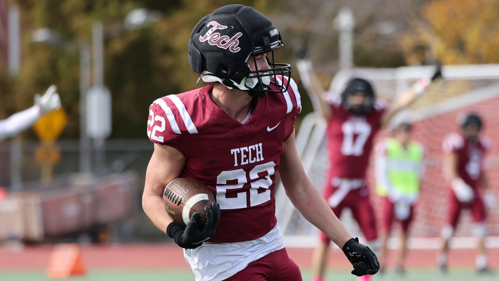 Dominic Hess running past a defender with the football