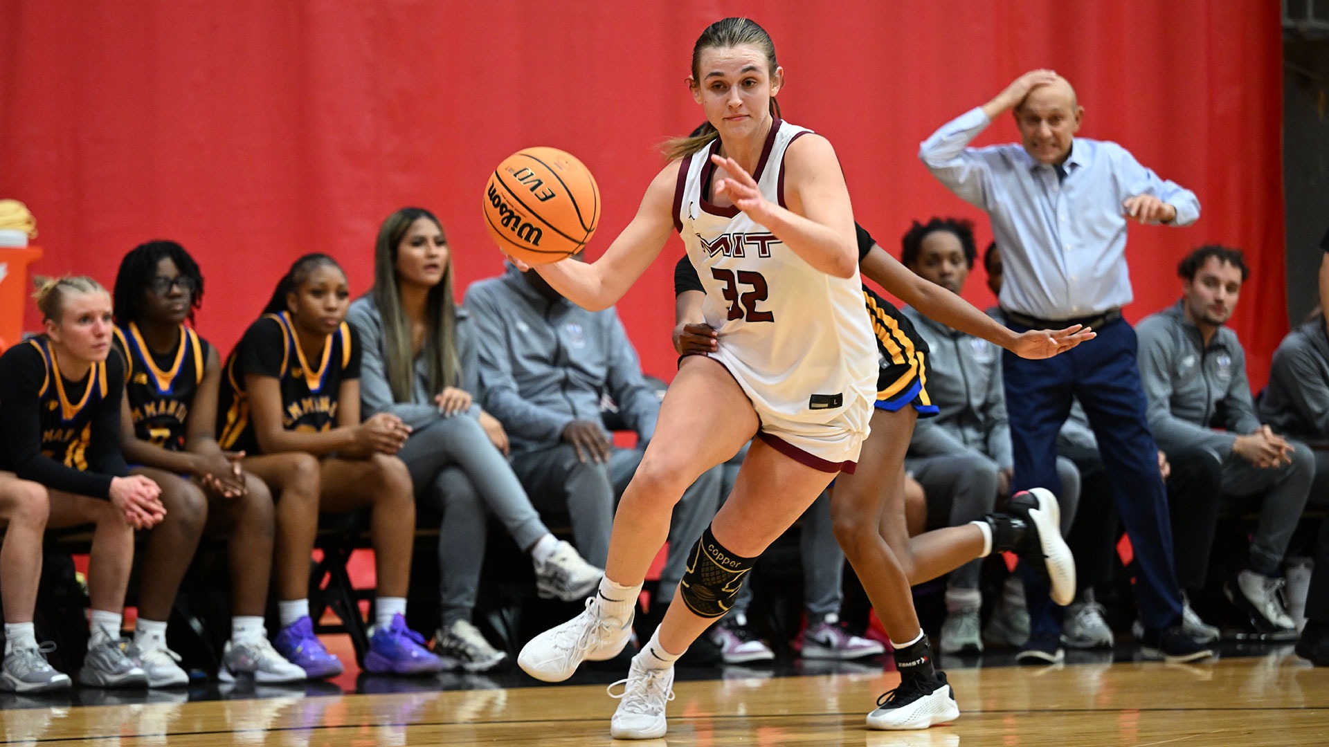 Olivia Joseph dribbling the basketball