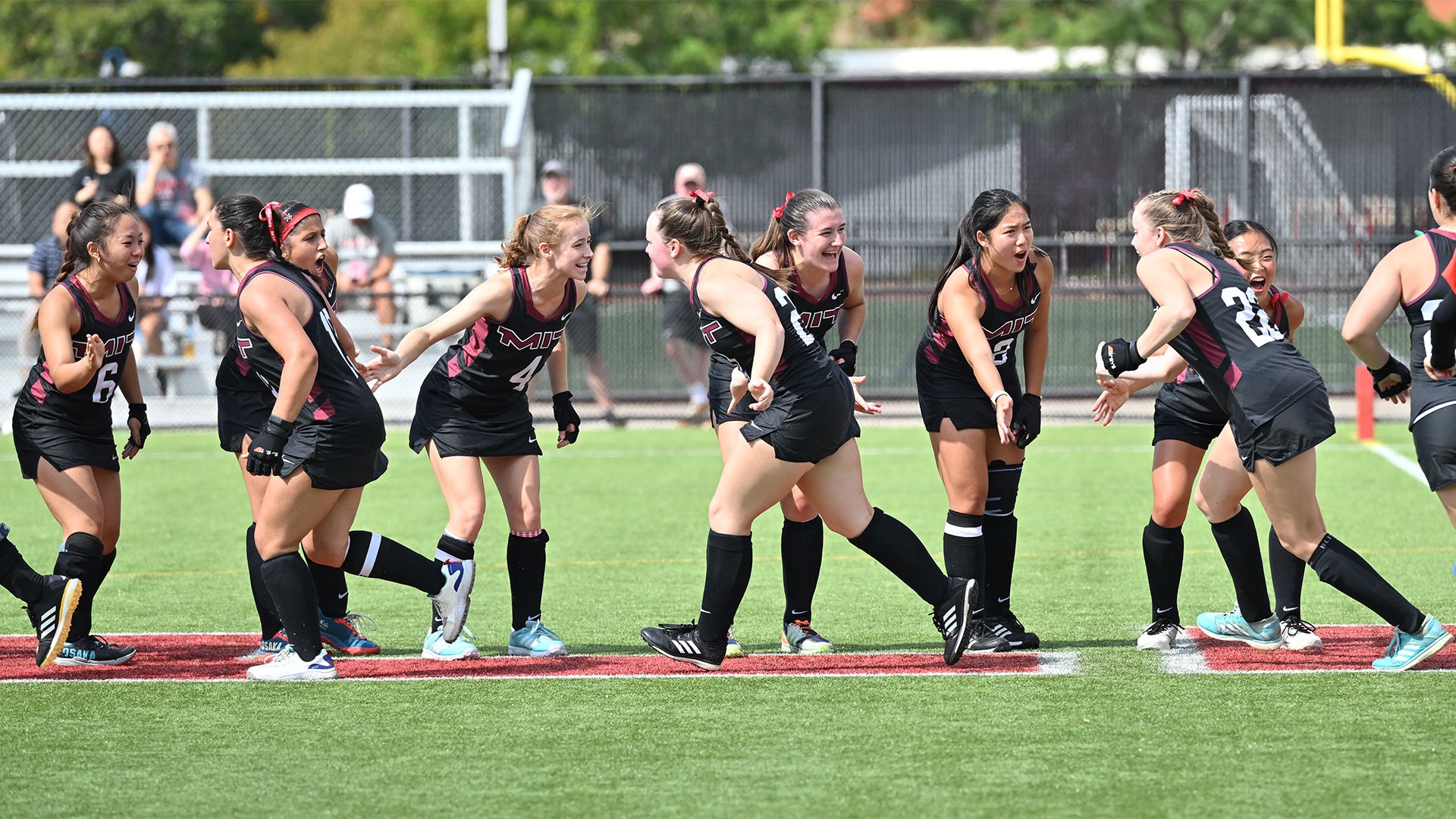 Members of the MIT field hockey team cheering