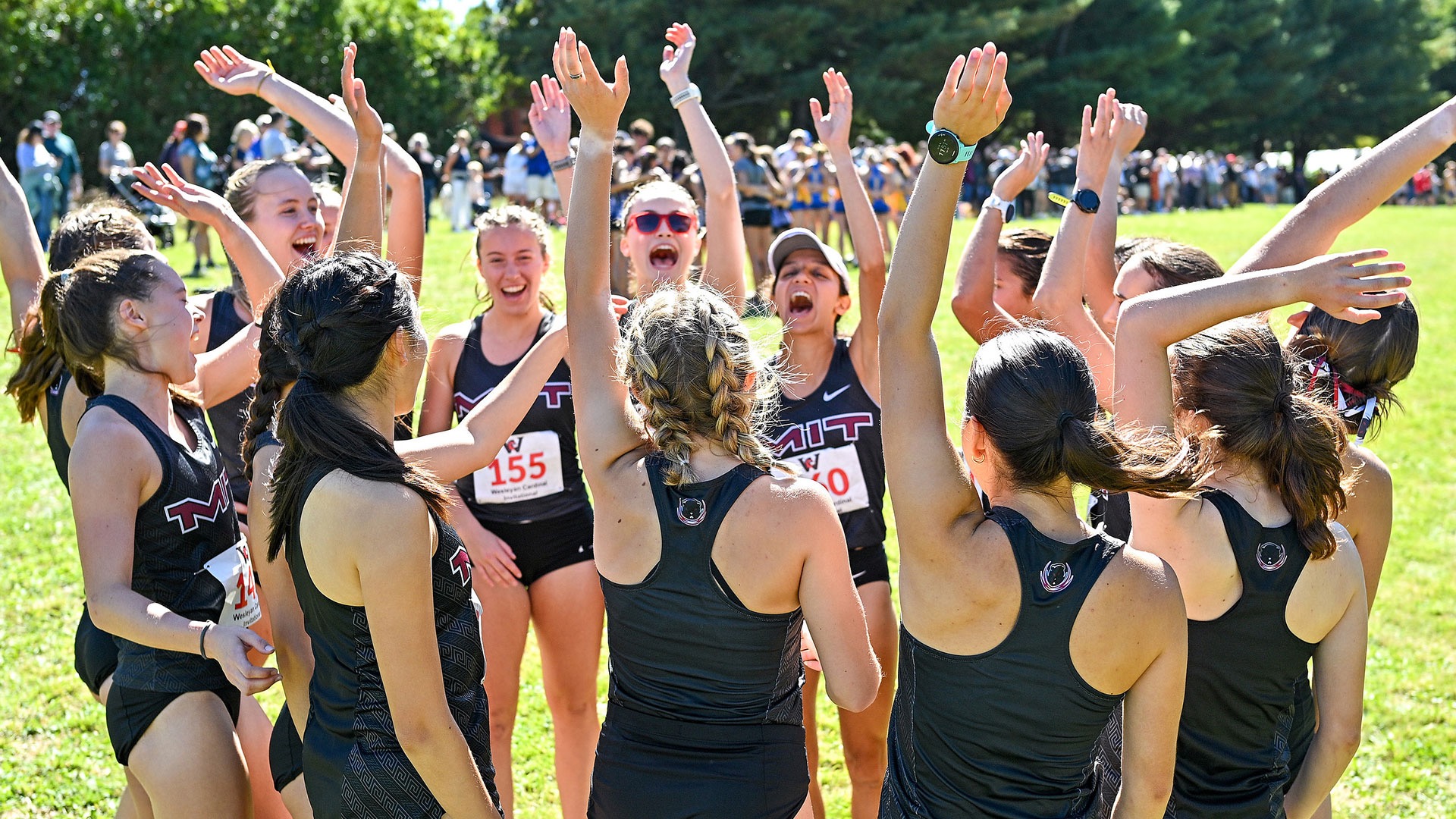 women's cross country team huddle