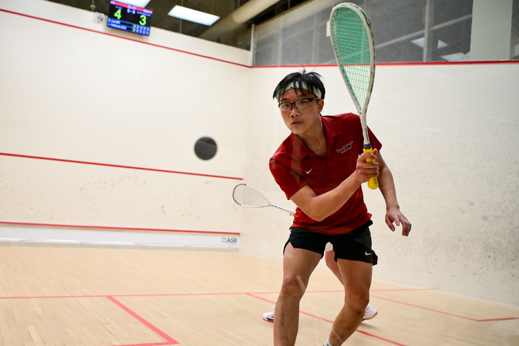 Eddie Xue playing a ball off the wall