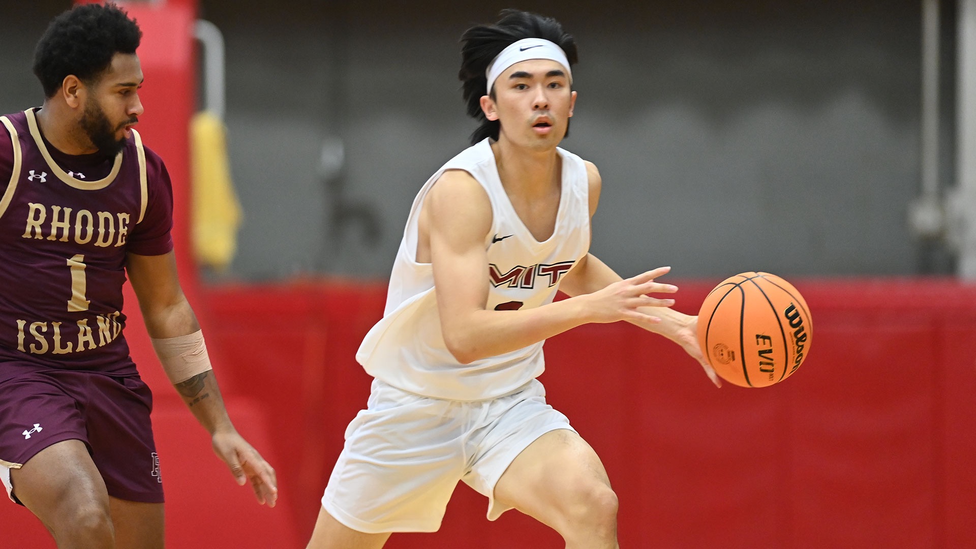 Michael Zhang dribbling a basketball