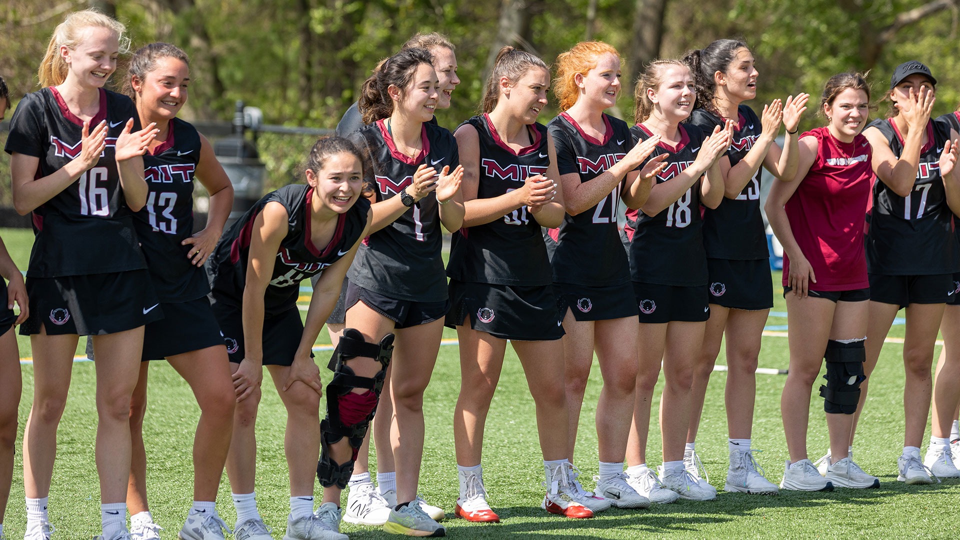 The MIT women's lacrosse team cheering