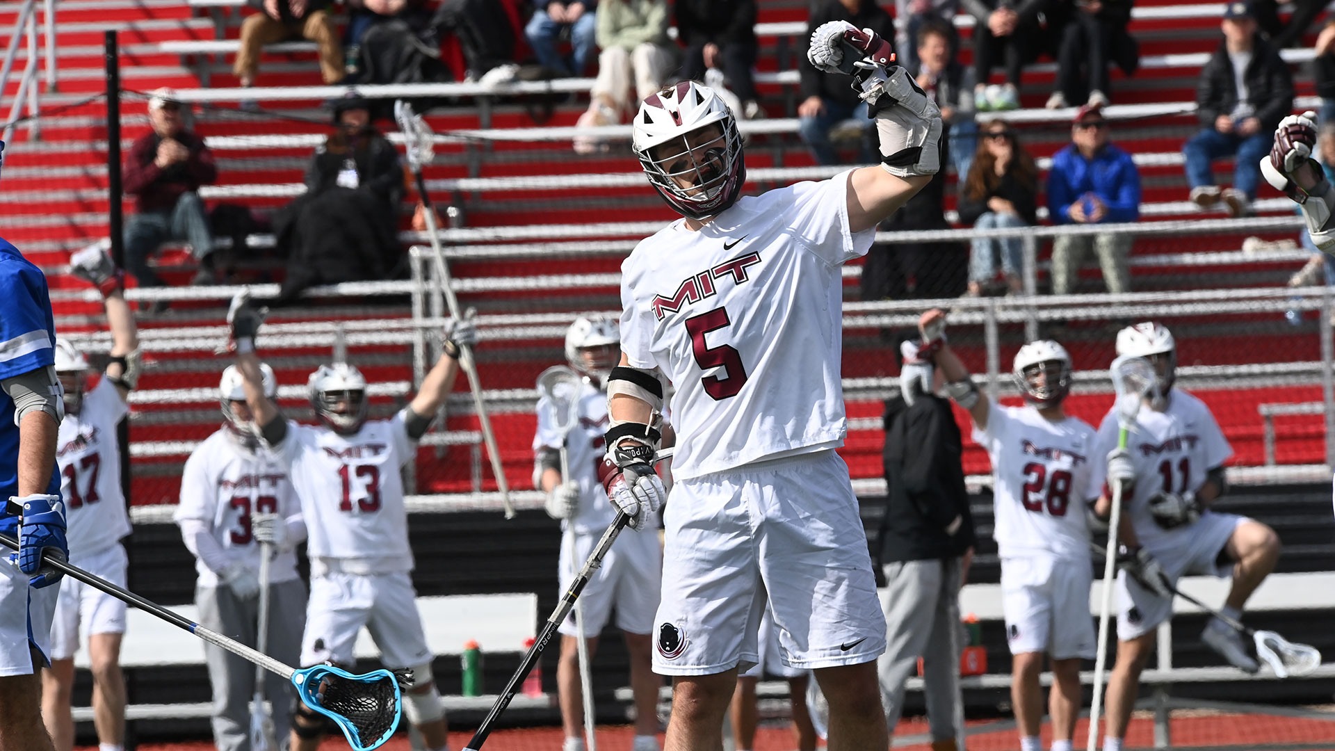 Dylan Nelson and members of the men's lacrosse team celebrating