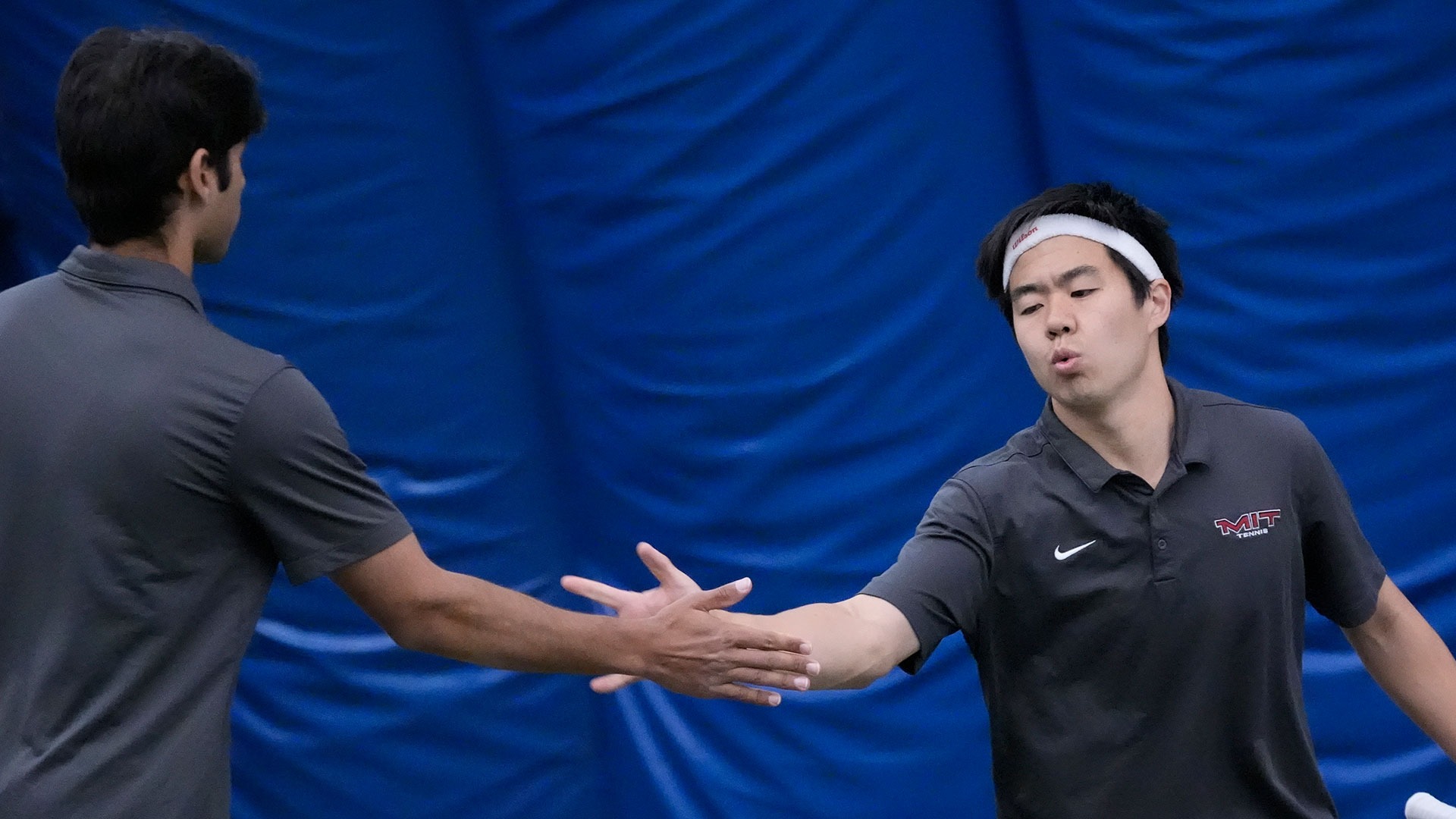 Ryan Xiao and teammate high fiving