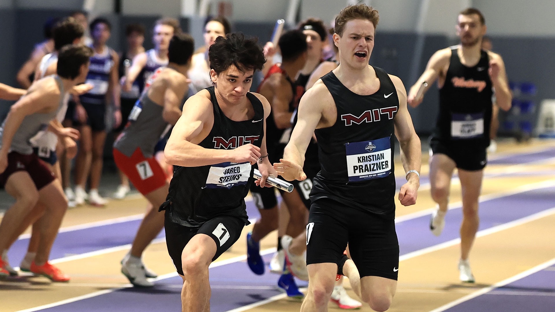 MIT men's track and field running a relay race