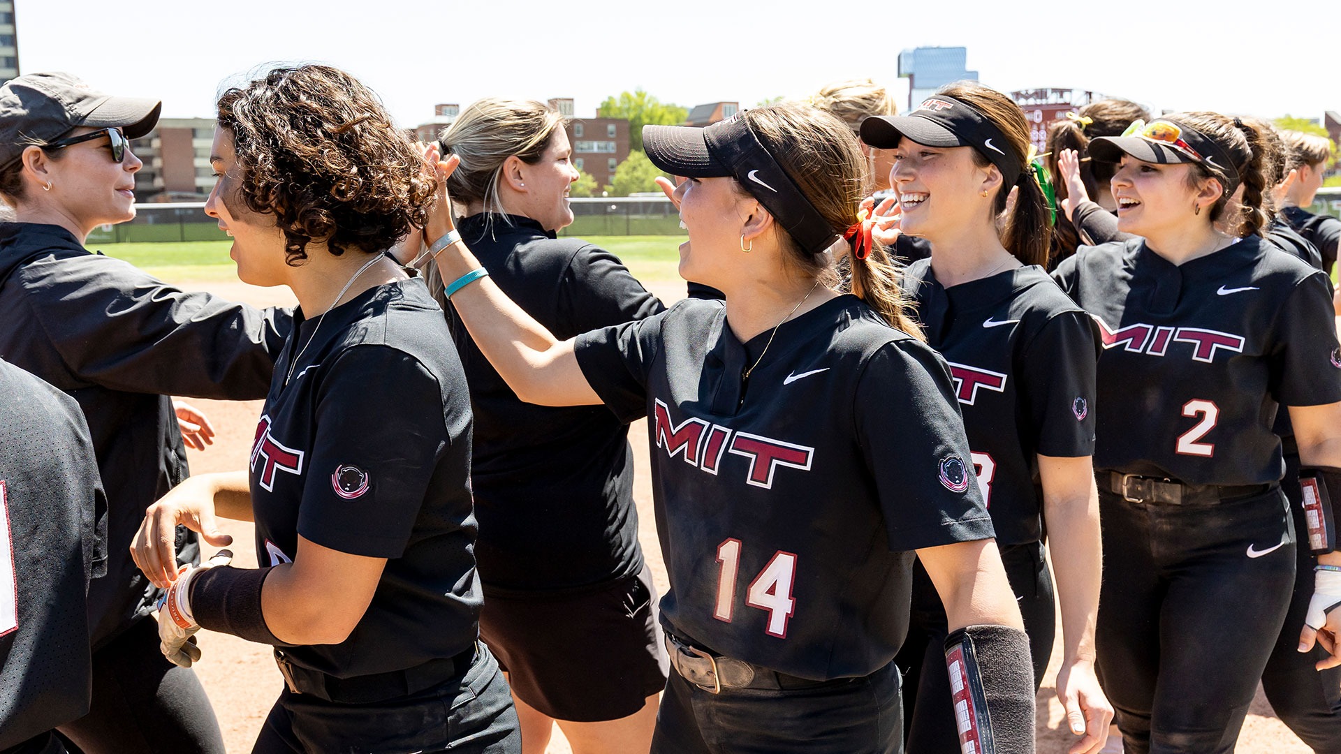 Softball team giving high-fives after a win
